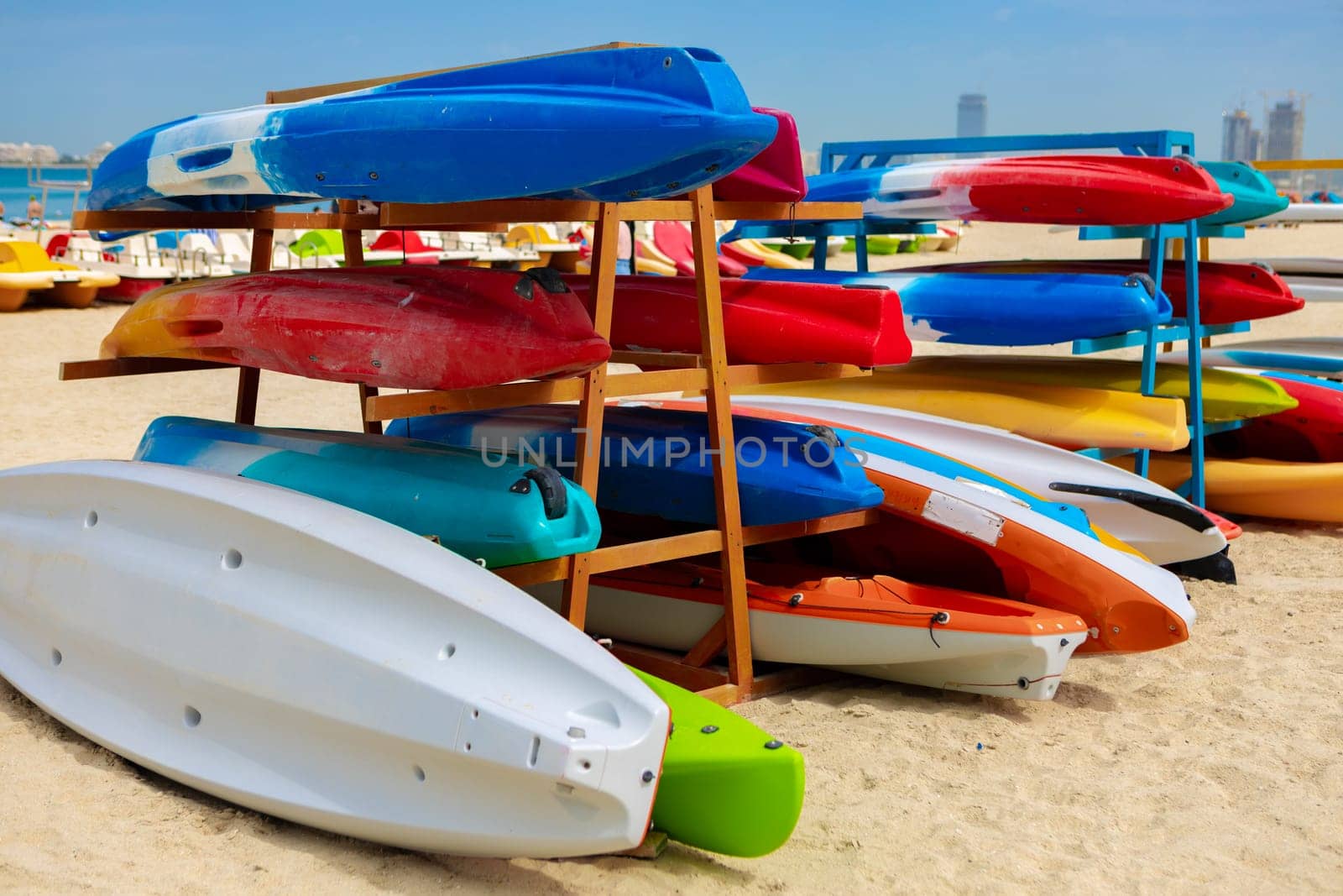 Surfboards stacked on the rack on a beach, close up