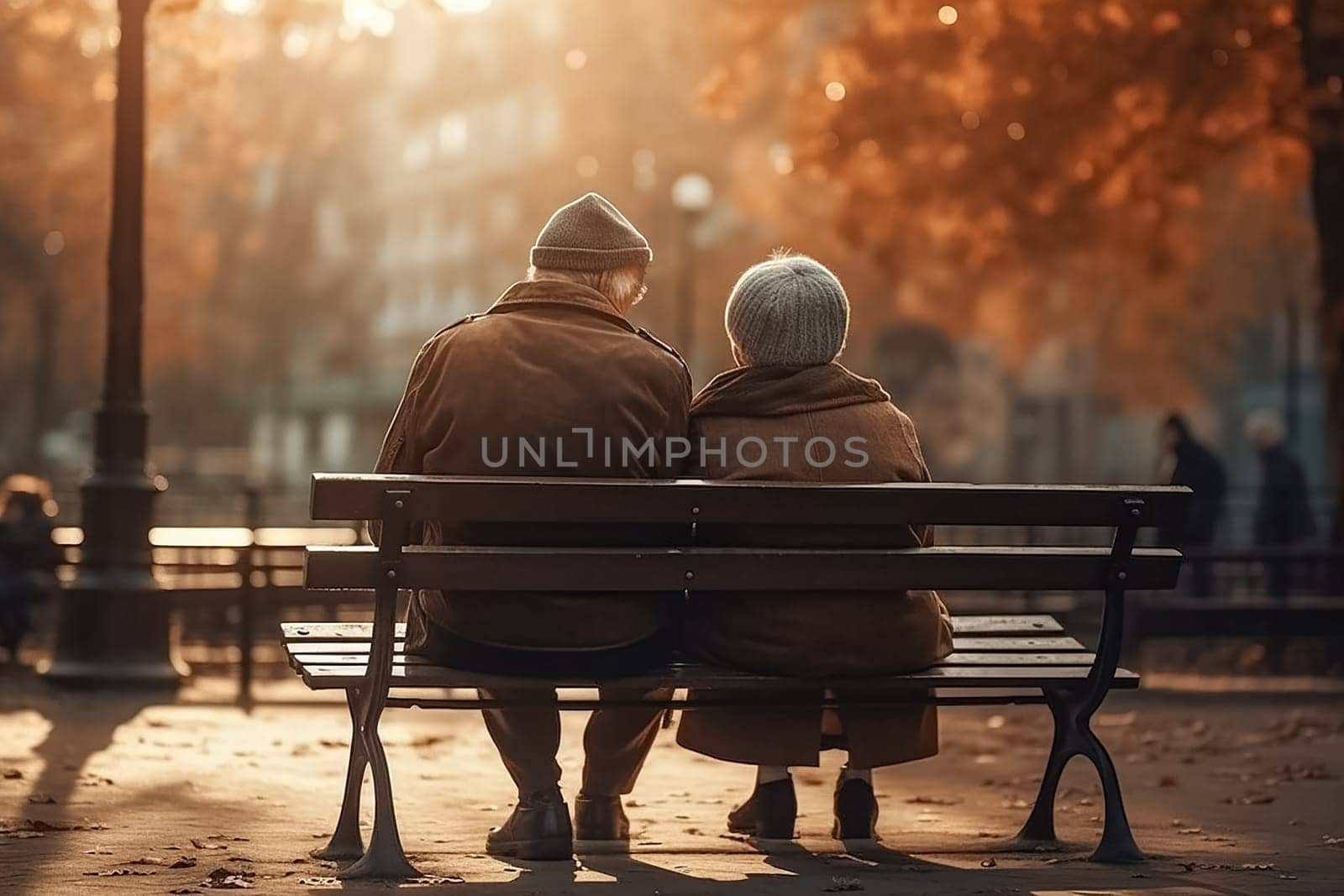 Grandma and grandpa, elderly people, aged old married couple sitting on a bench in the park and talking, enjoying nature.