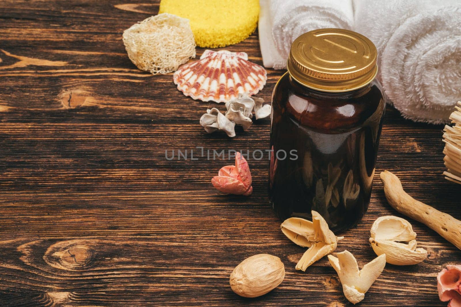Spa and beauty threatment products on wooden background, top view