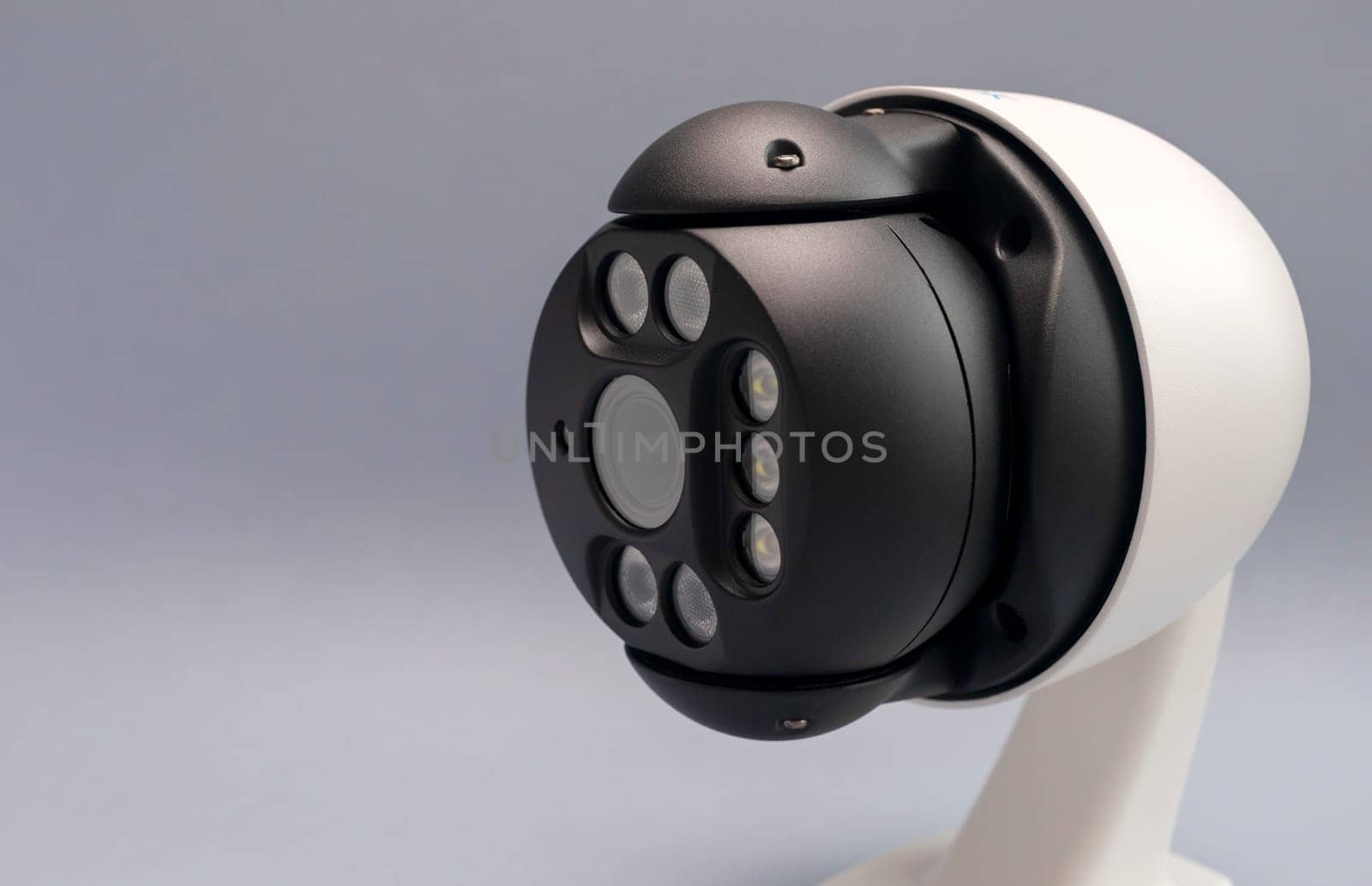 Closeup White IP Smart Outdoor Security Camera, Home, House Surveillance, System With Optical Zoom,Water Proof Cover On Gray Background.Facial Recognition.Copy Space For Text, Horizontal Plane