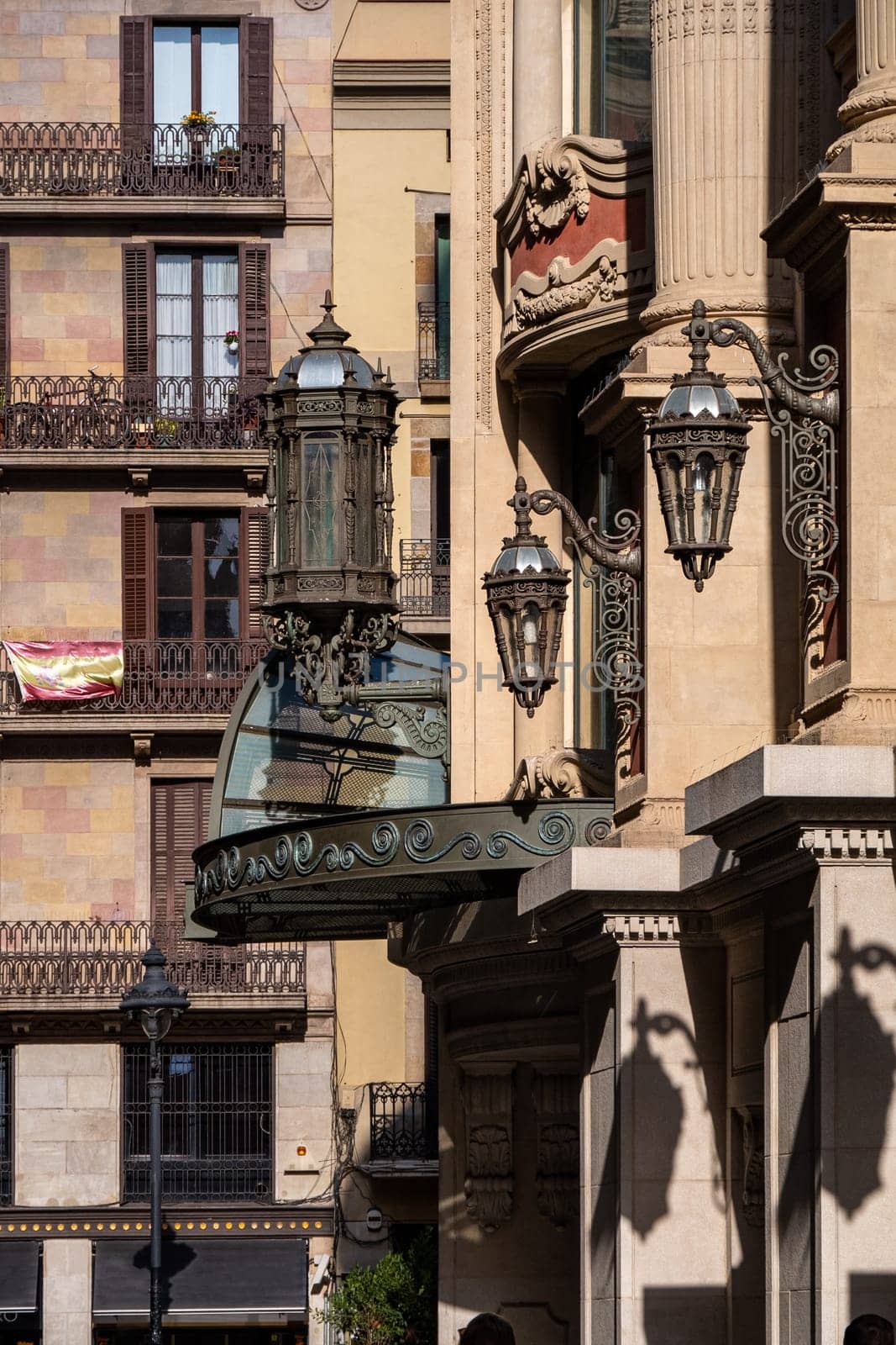 An ancient street lamp on street of Santa Ana in Barcelona