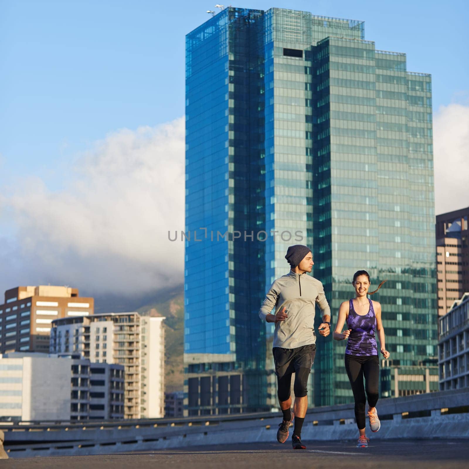 Early morning calm. two friends out jogging in the city