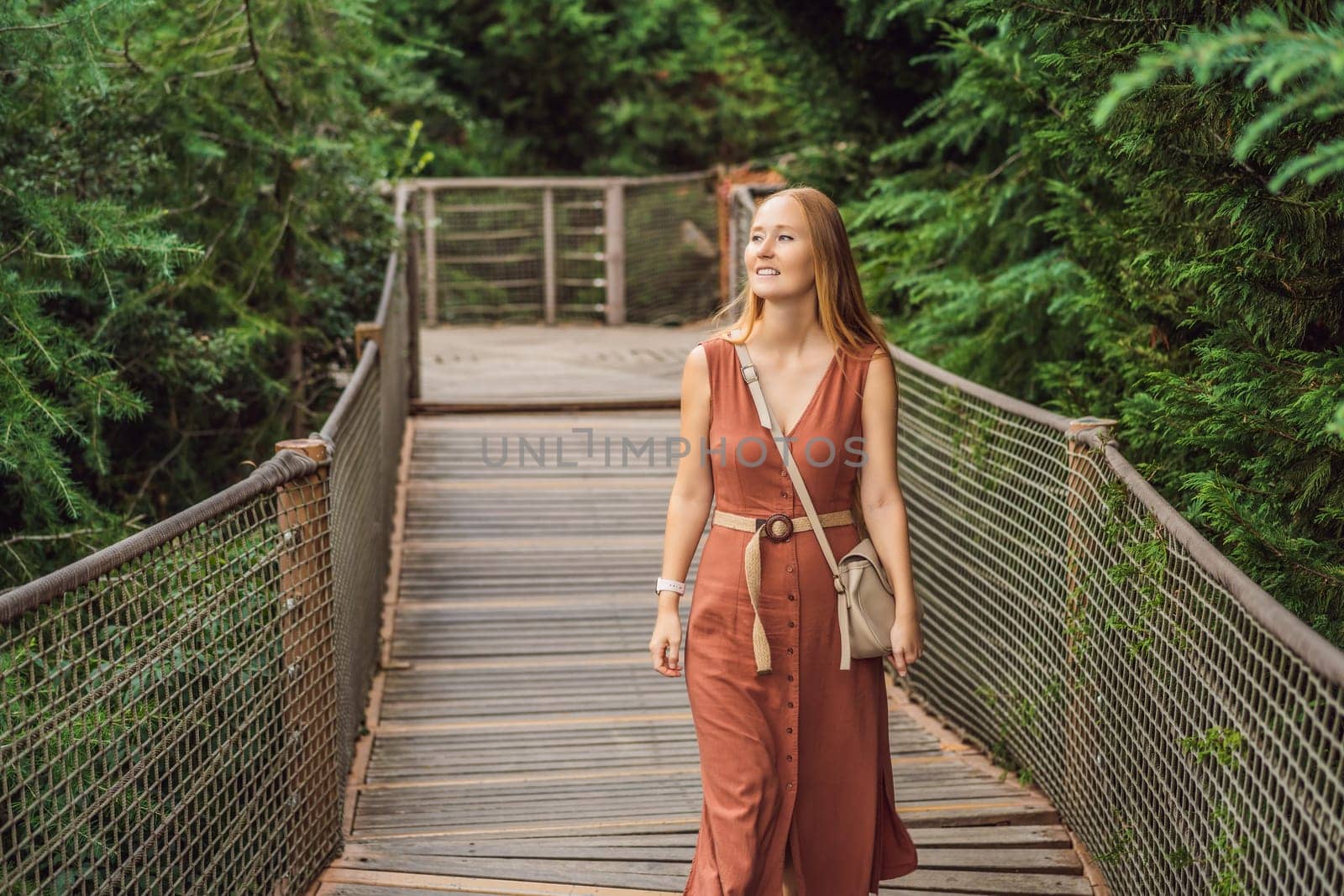 Woman tourist in Rope bridge in Yildiz Park. Besiktas, Istanbul, Turkey. Turkiye.