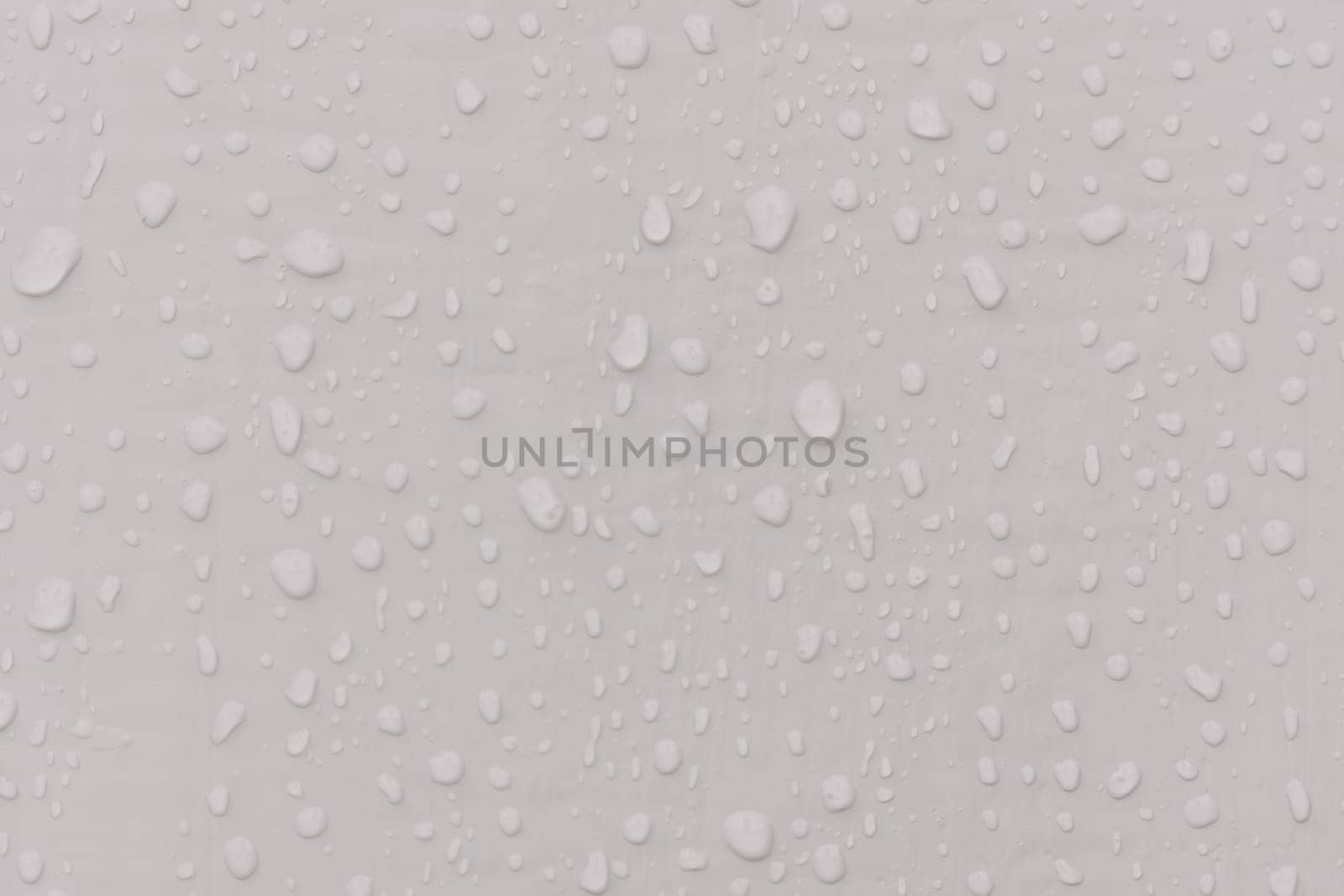 Water drops an gray surface. Abstract water drops background
