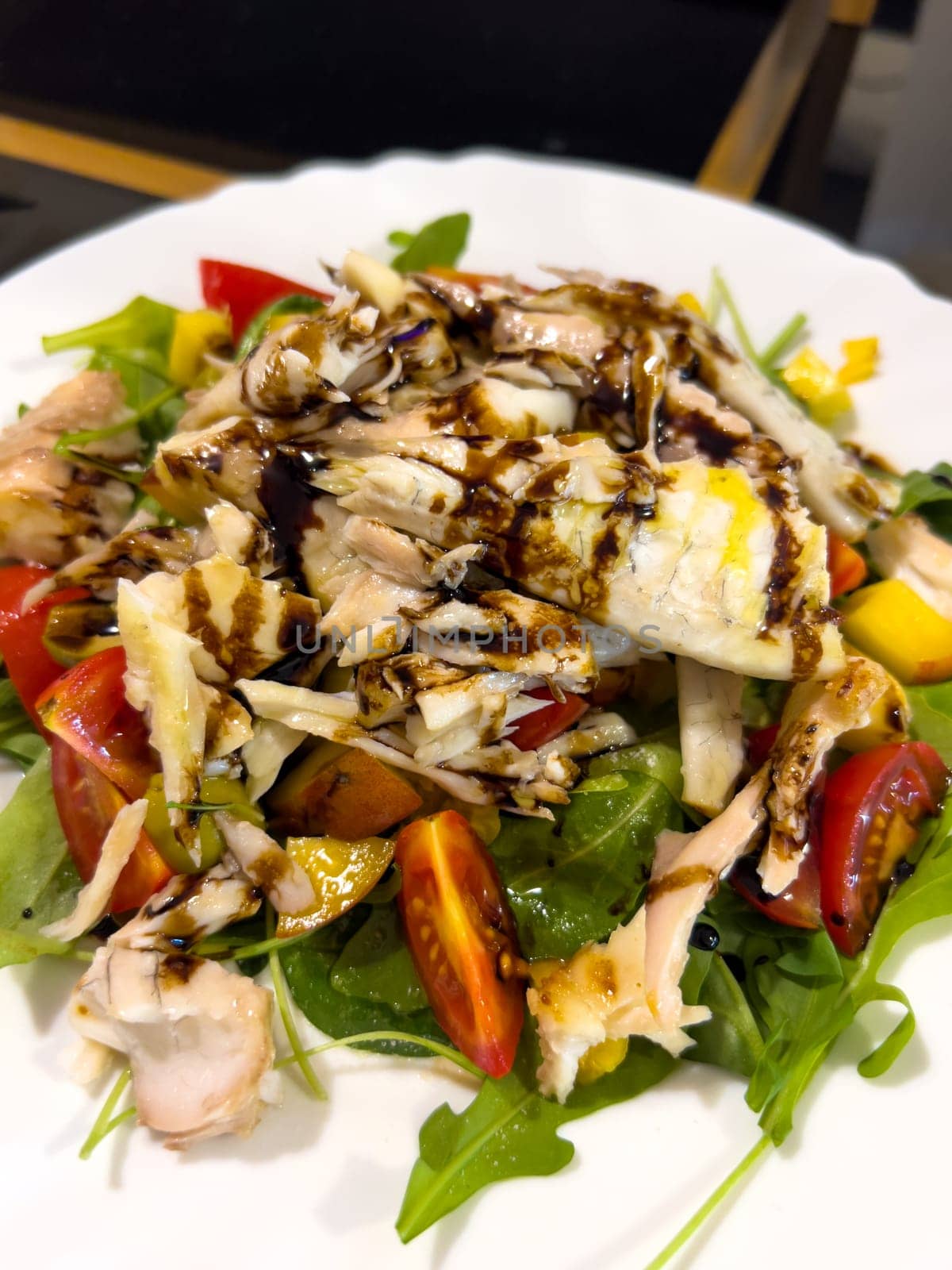 Salad with chicken breast, tomatoes, herbs and soy sauce. High quality photo