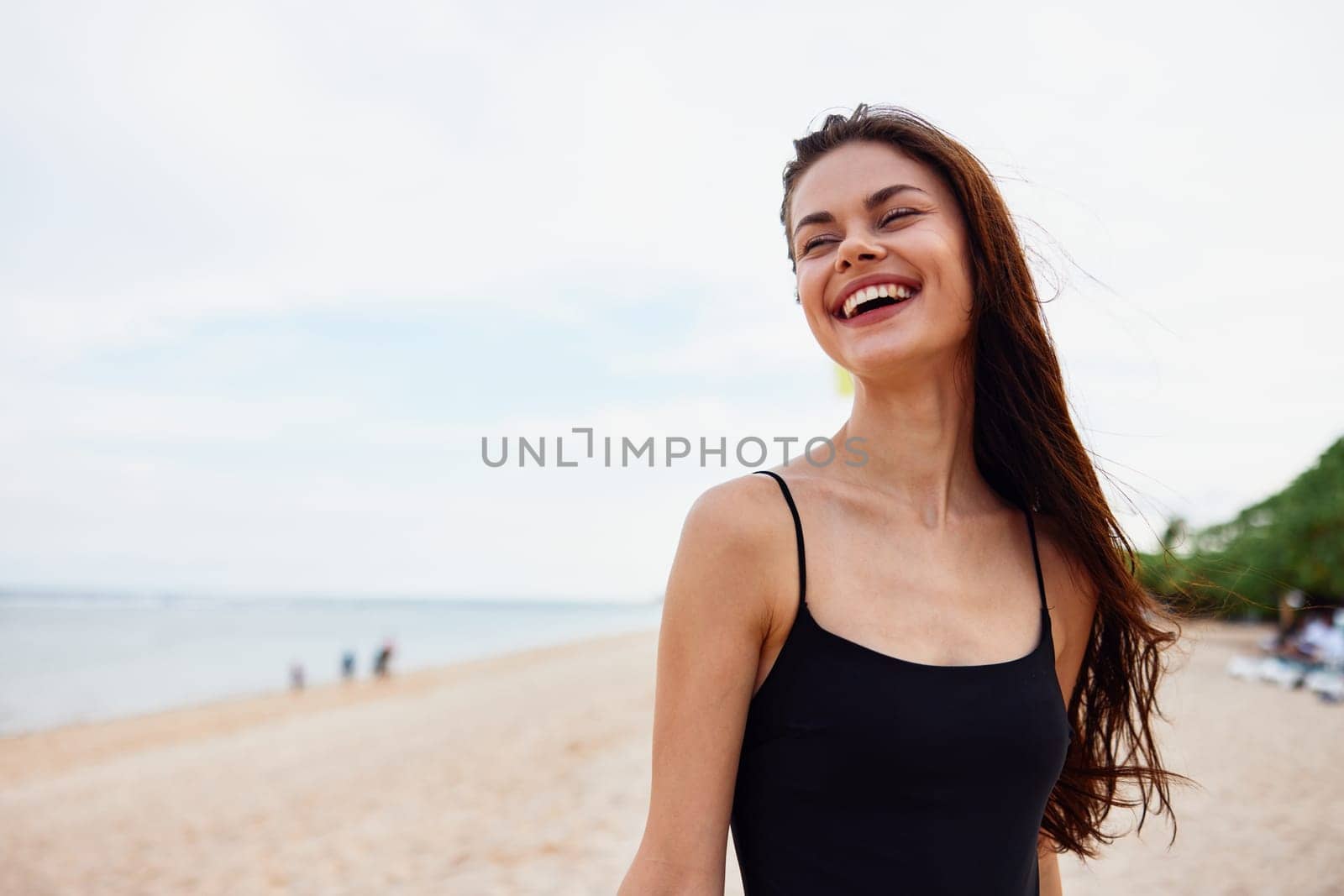 woman leisure sea sky summer young smile girl peaceful enjoyment vacation walking copy-space bag beach coast tropical nature sand ocean sun