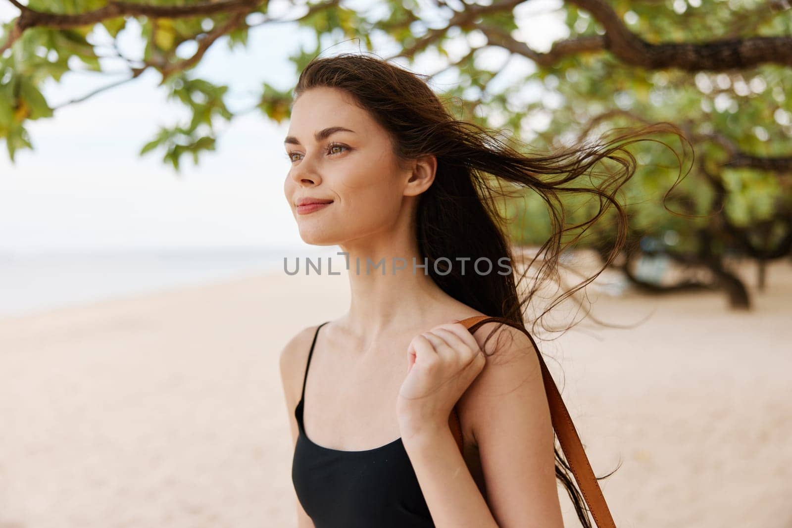 woman long ocean nature walk summer person beautiful sky hair sea travel young beach sand holiday vacation sun girl smile caucasian smiling