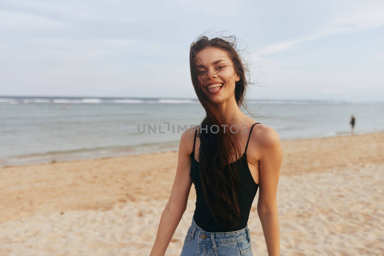 woman lifestyle young female summer holiday sea ocean caucasian sunset smile freedom vacation adult beach hair tropical long sand girl walking nature