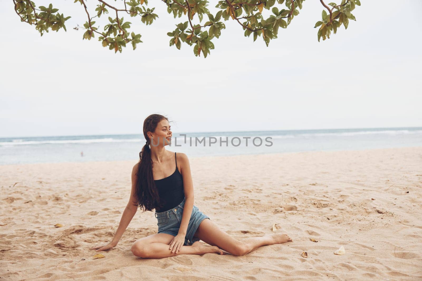smile woman sea fashion beach vacation sand nature freedom travel sitting by SHOTPRIME