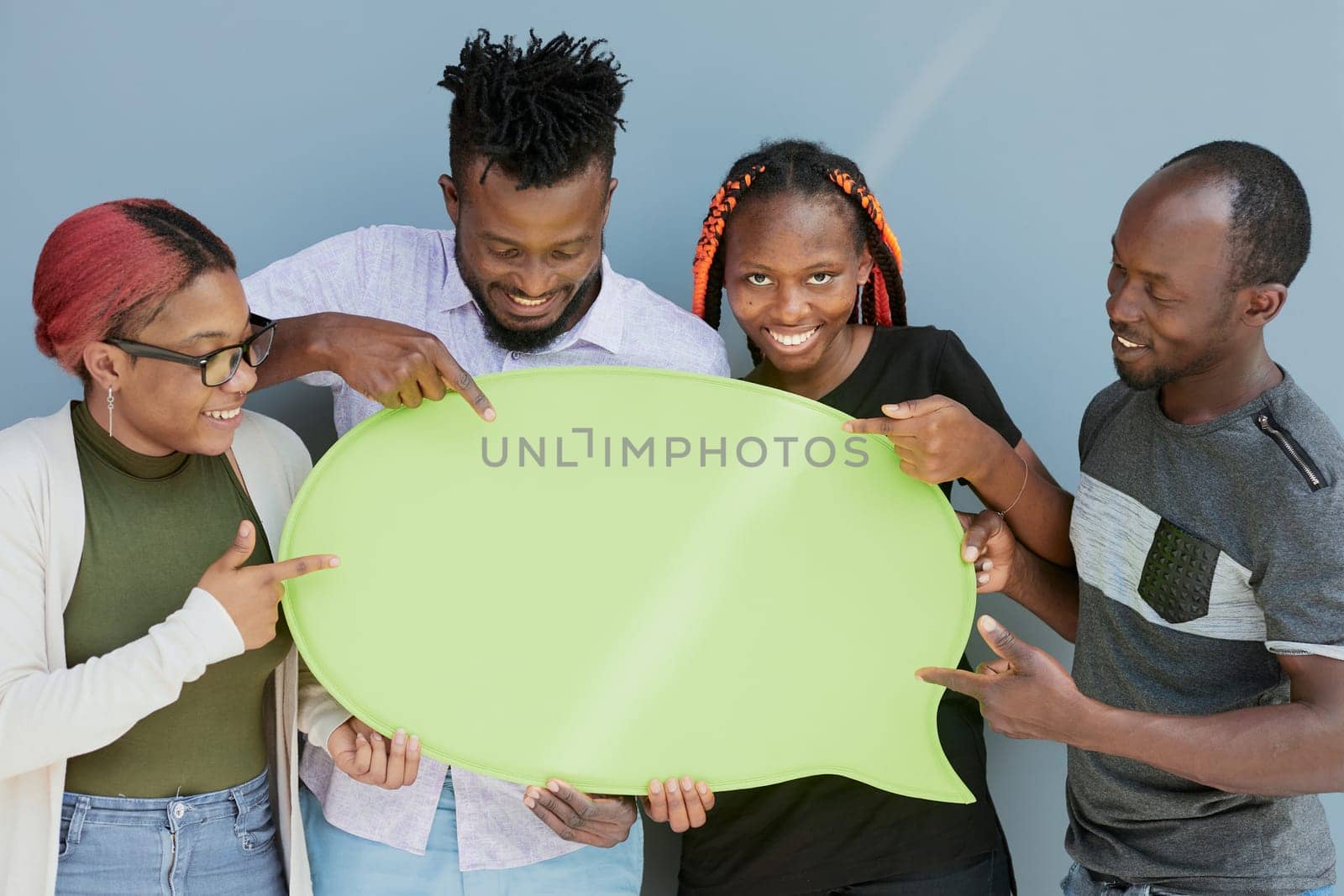 Young african american friends holding up copyspace placard thought bubbles by Prosto