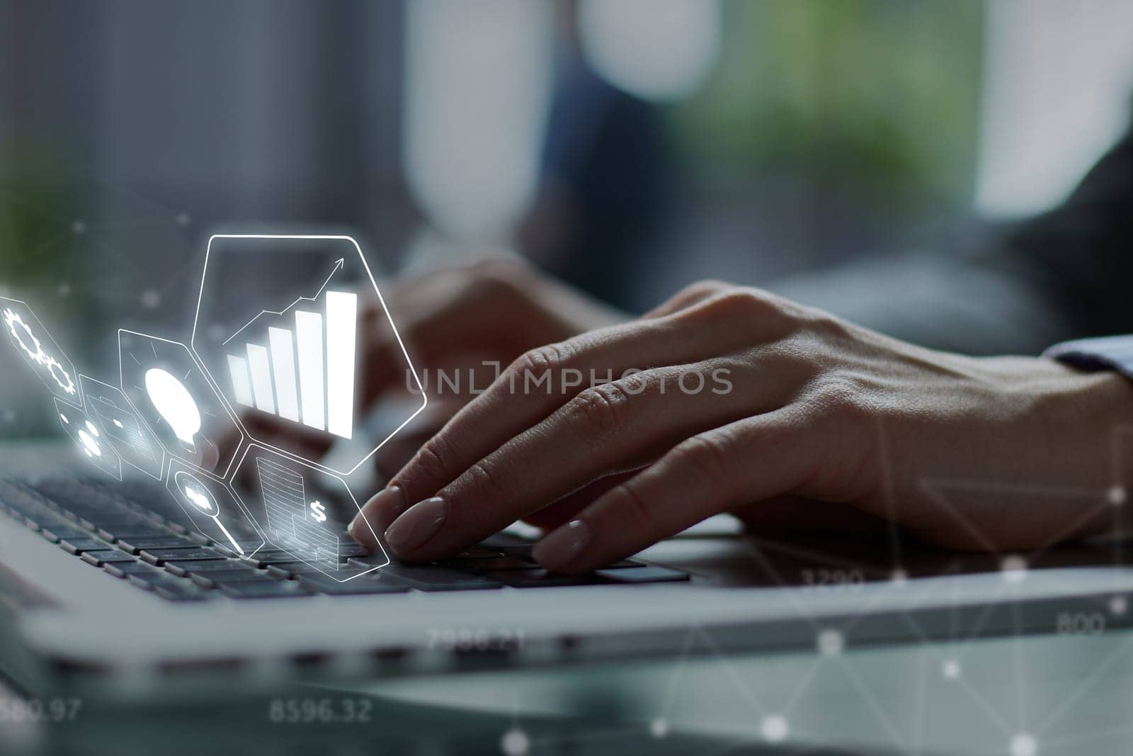 man's hands typing on laptop keyboard in interior