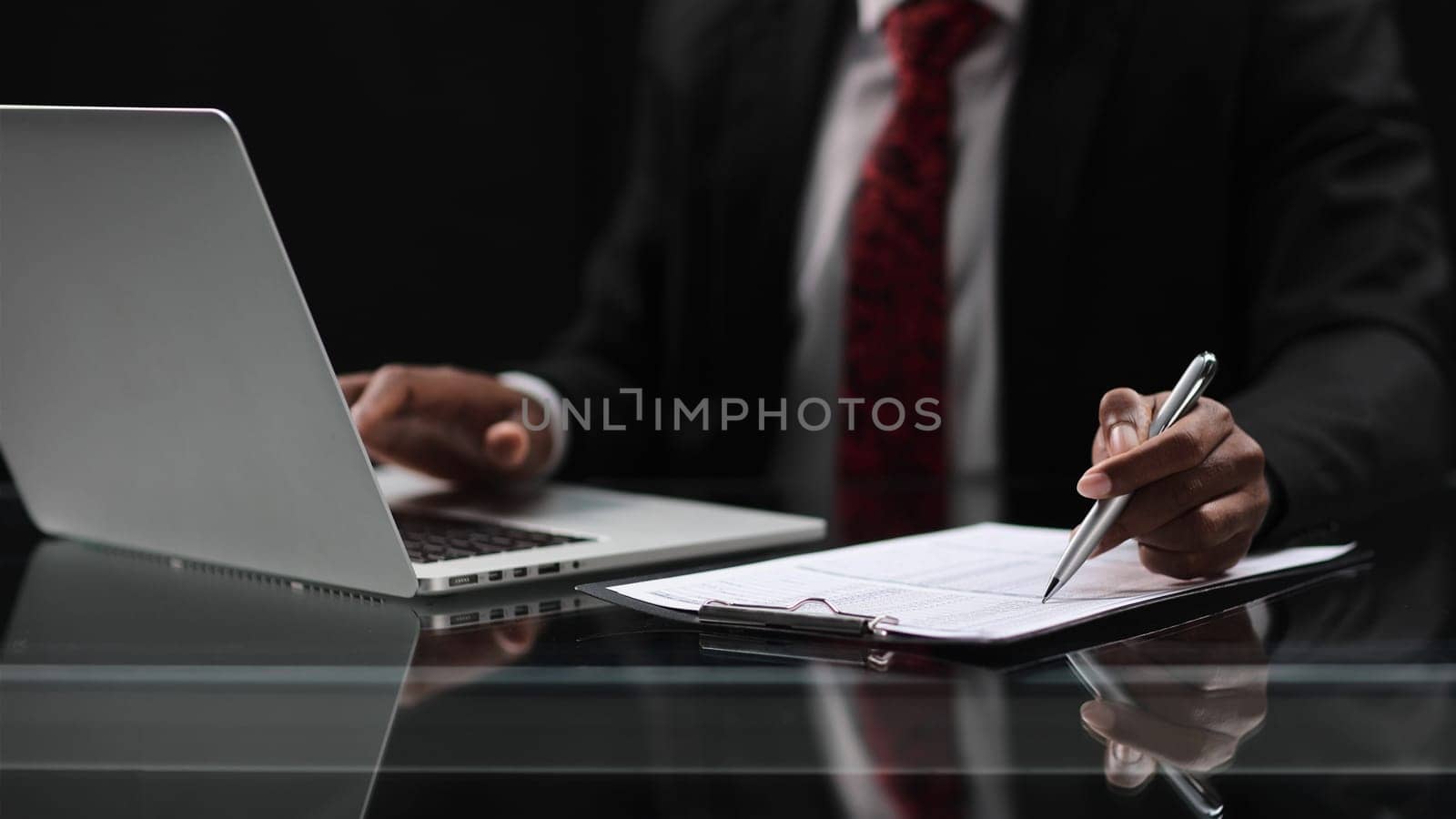 man using laptop or computer working at home in the at night