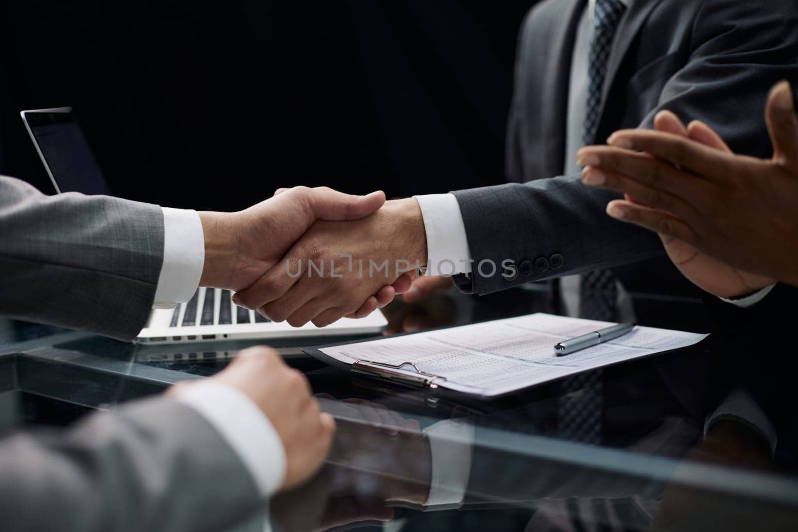 businessman shakes hands, making a deal with a lawyer. male judge legal