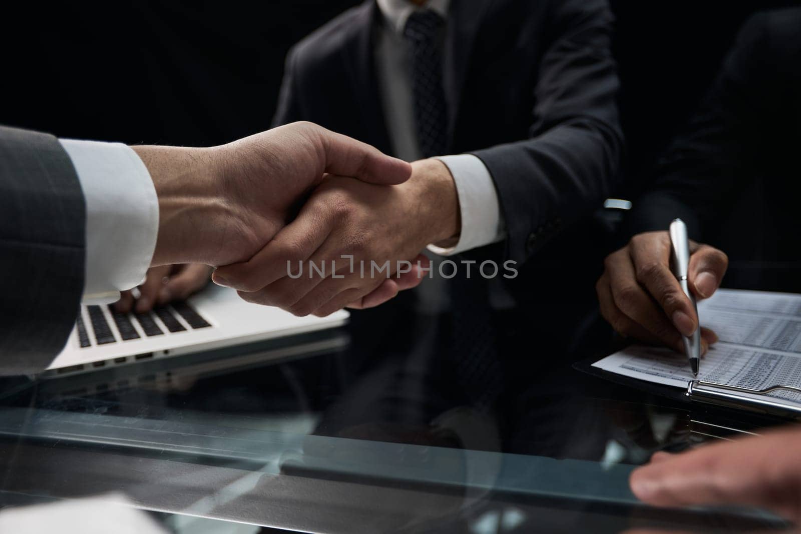 businessman shakes hands, making a deal with a lawyer. male judge legal