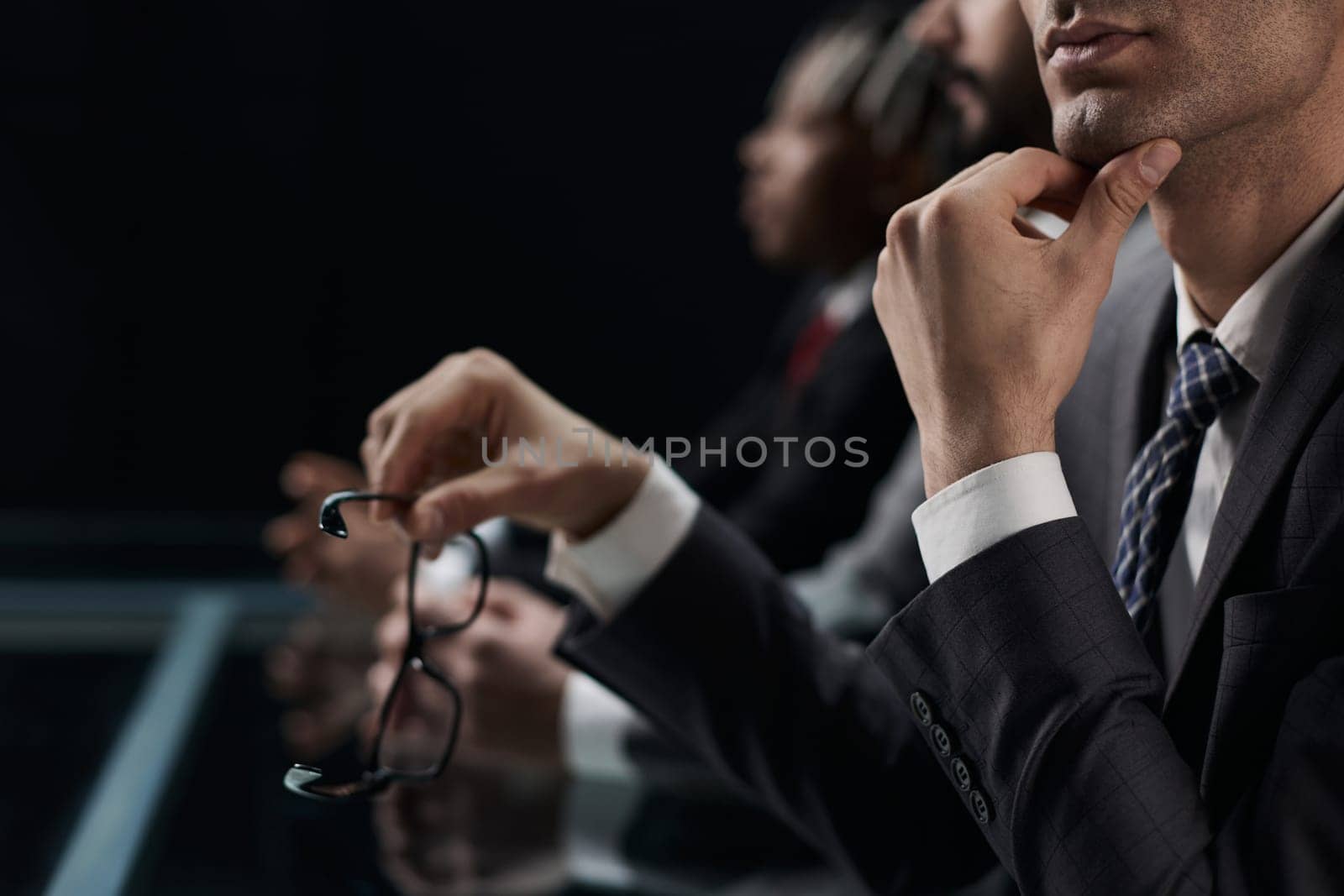 Close up of male hands holding a pair of glasses by Prosto