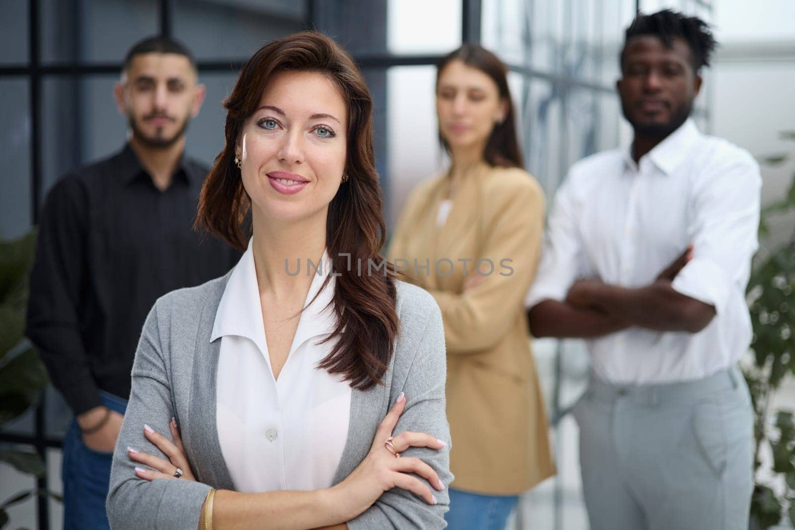 Portrait of a young business woman standing in the office