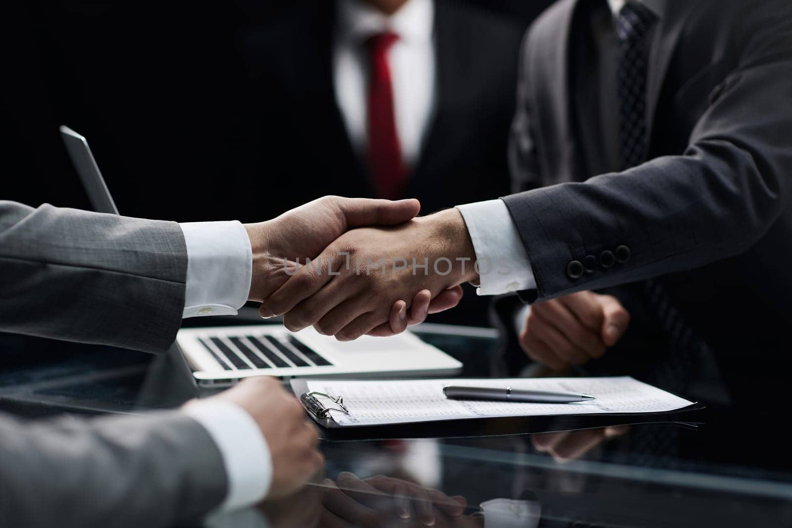 businessman shakes hands, making a deal with a lawyer. male judge legal