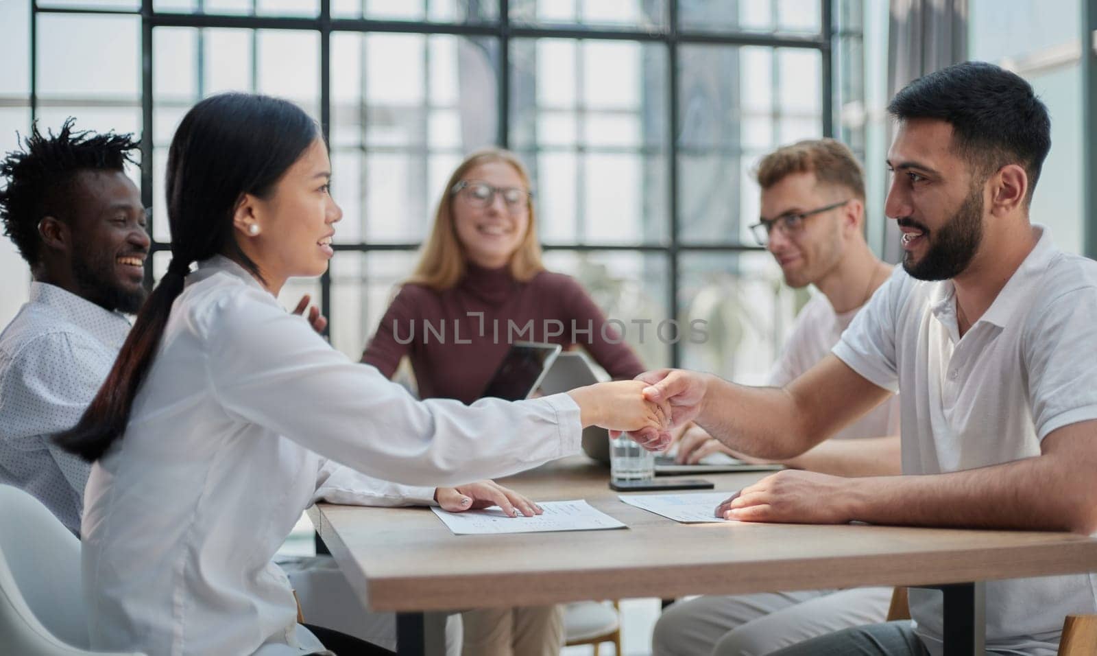 Business people discussing documents and ideas at meeting