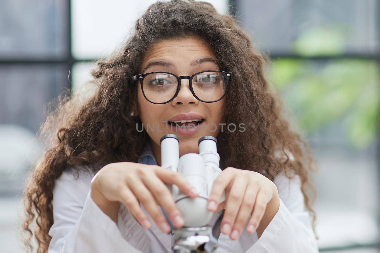 Female scientist researcher conducting an experiment in a labora