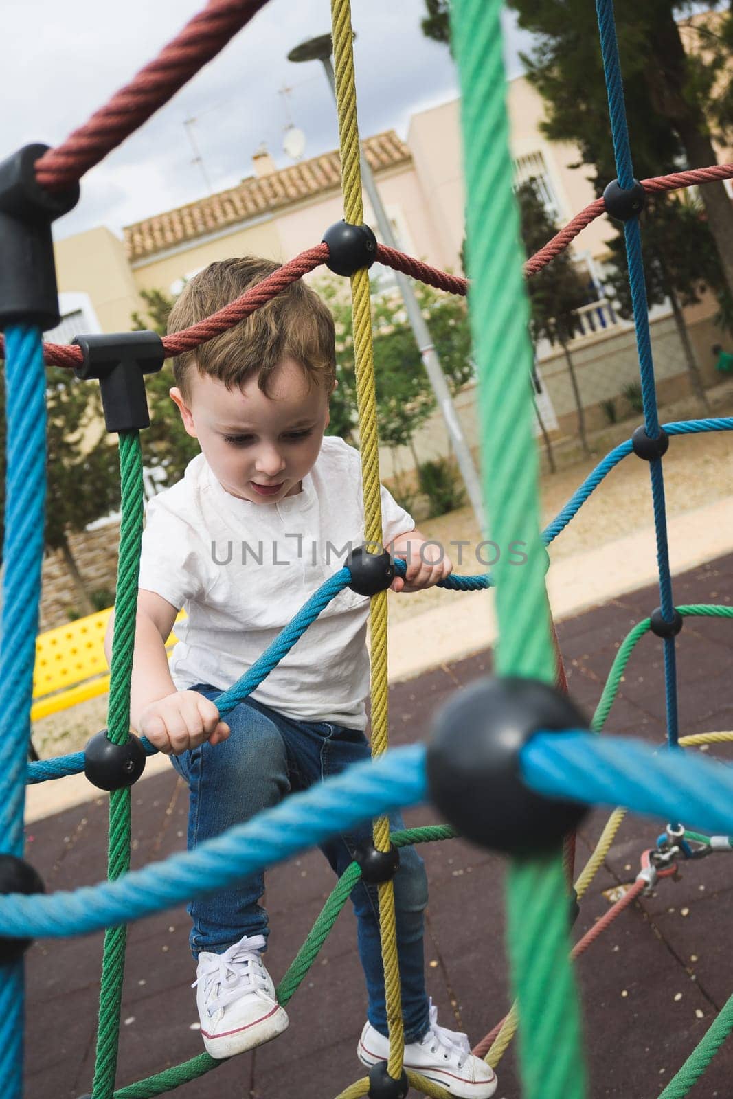 Child having fun on a swing by jcdiazhidalgo