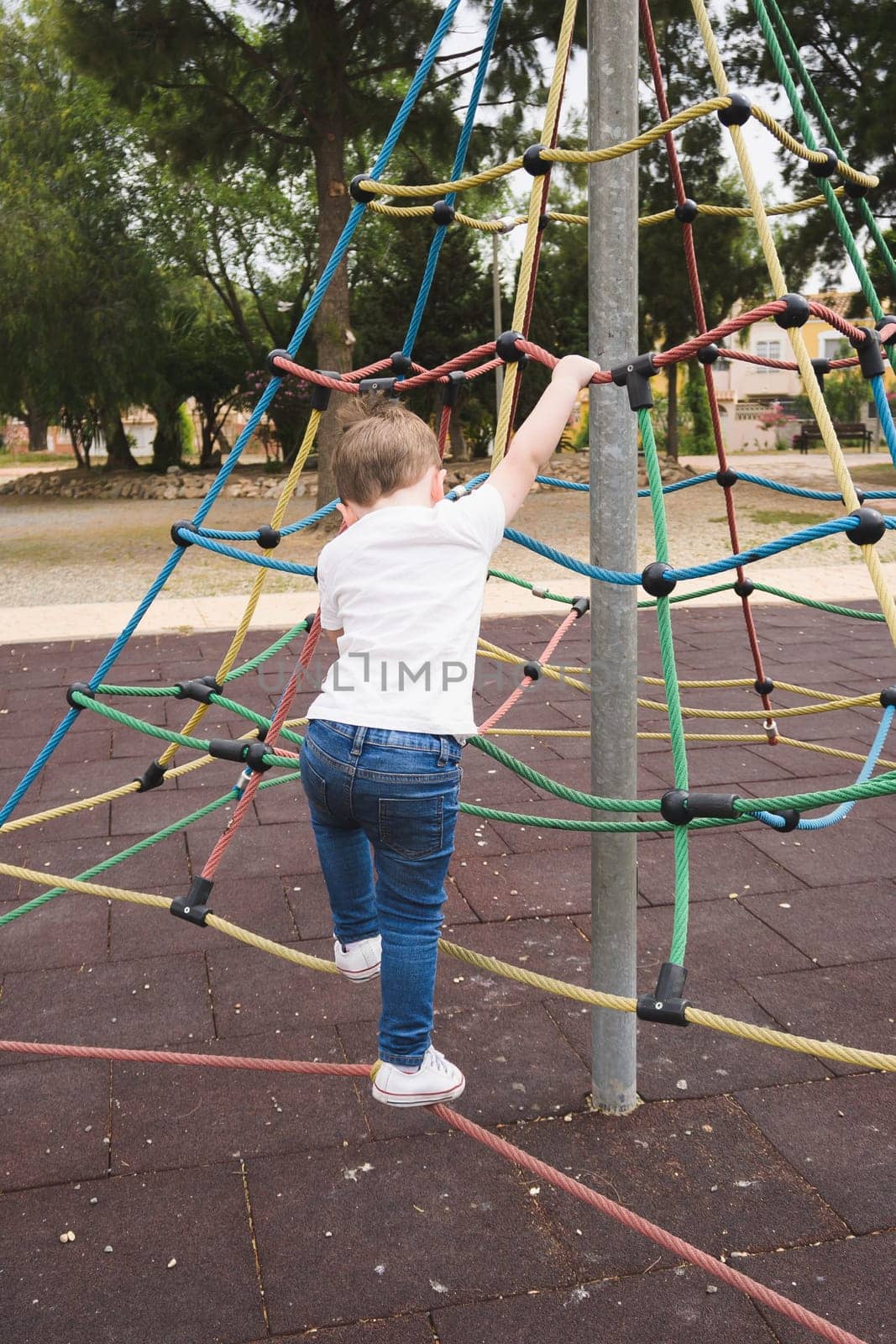Child having fun on a swing by jcdiazhidalgo
