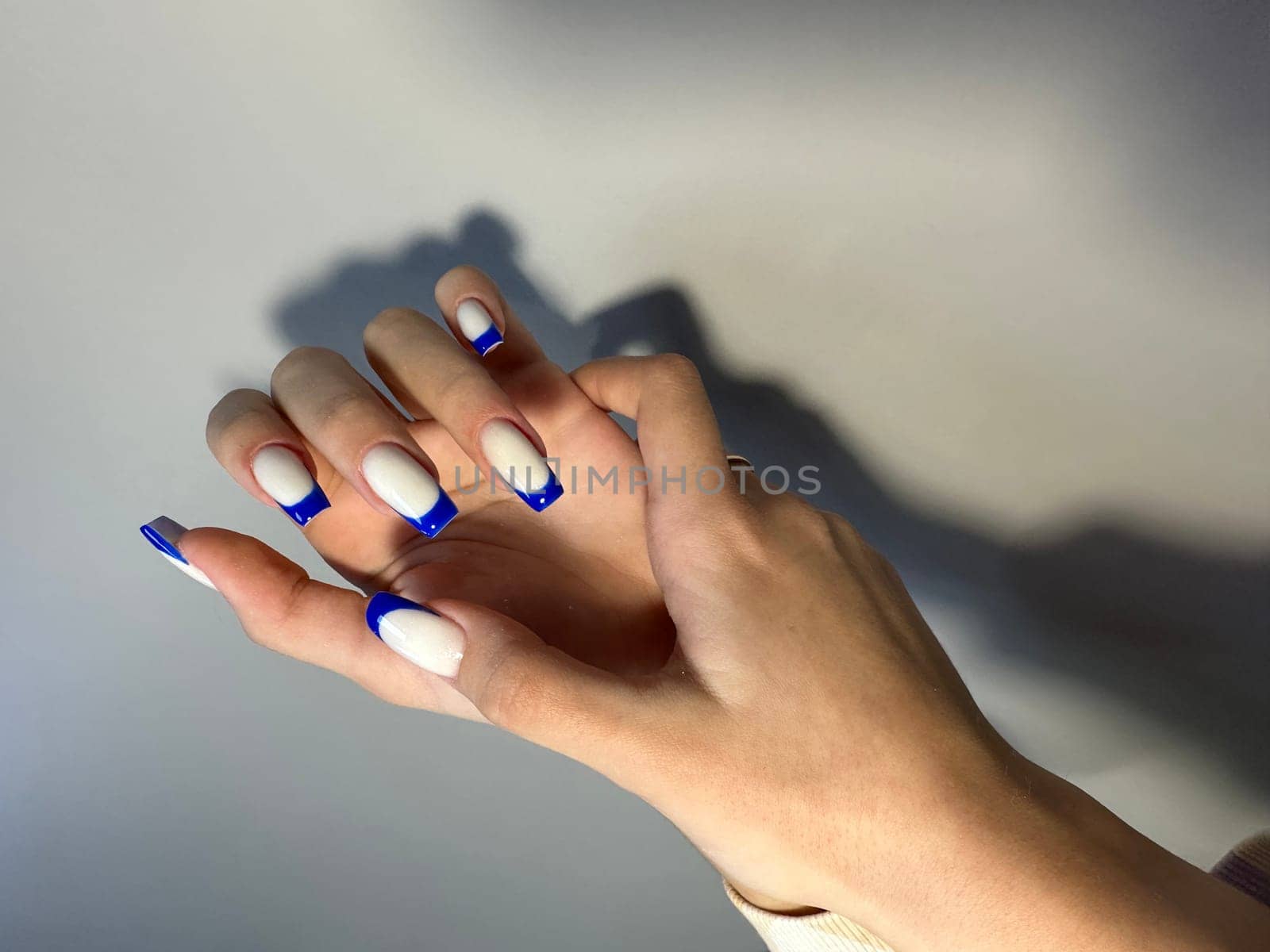 Closeup photo of a beautiful female hands by SmirMaxStock