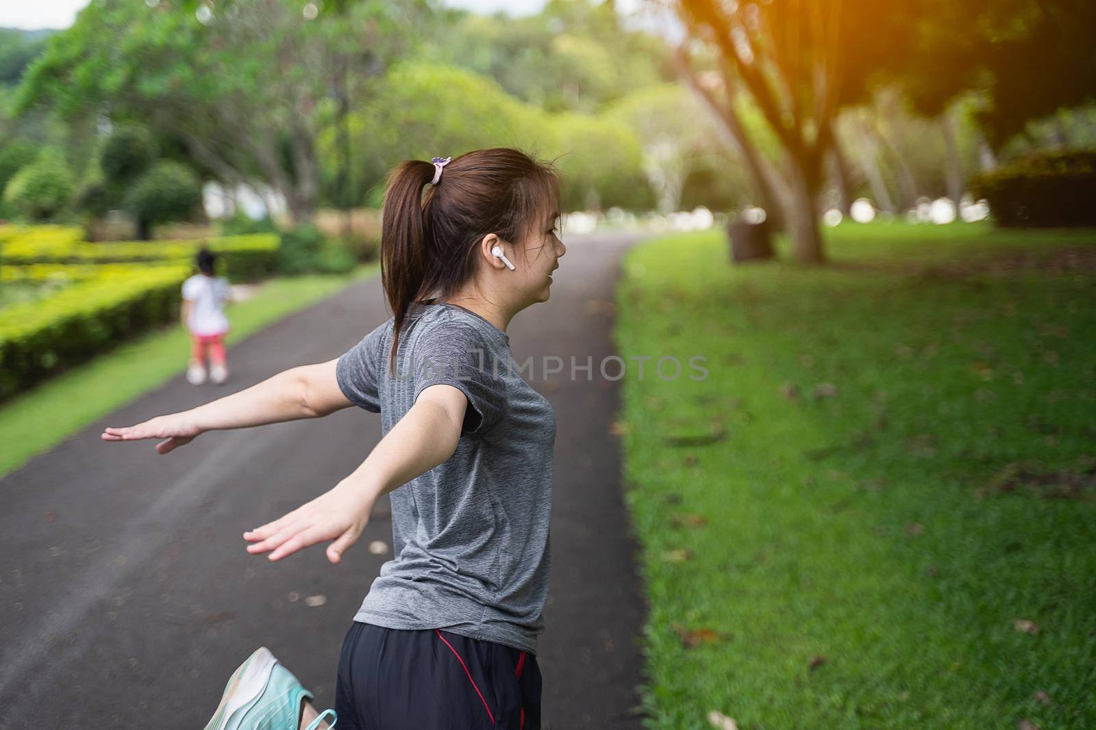 beautiful women streching before running at the park