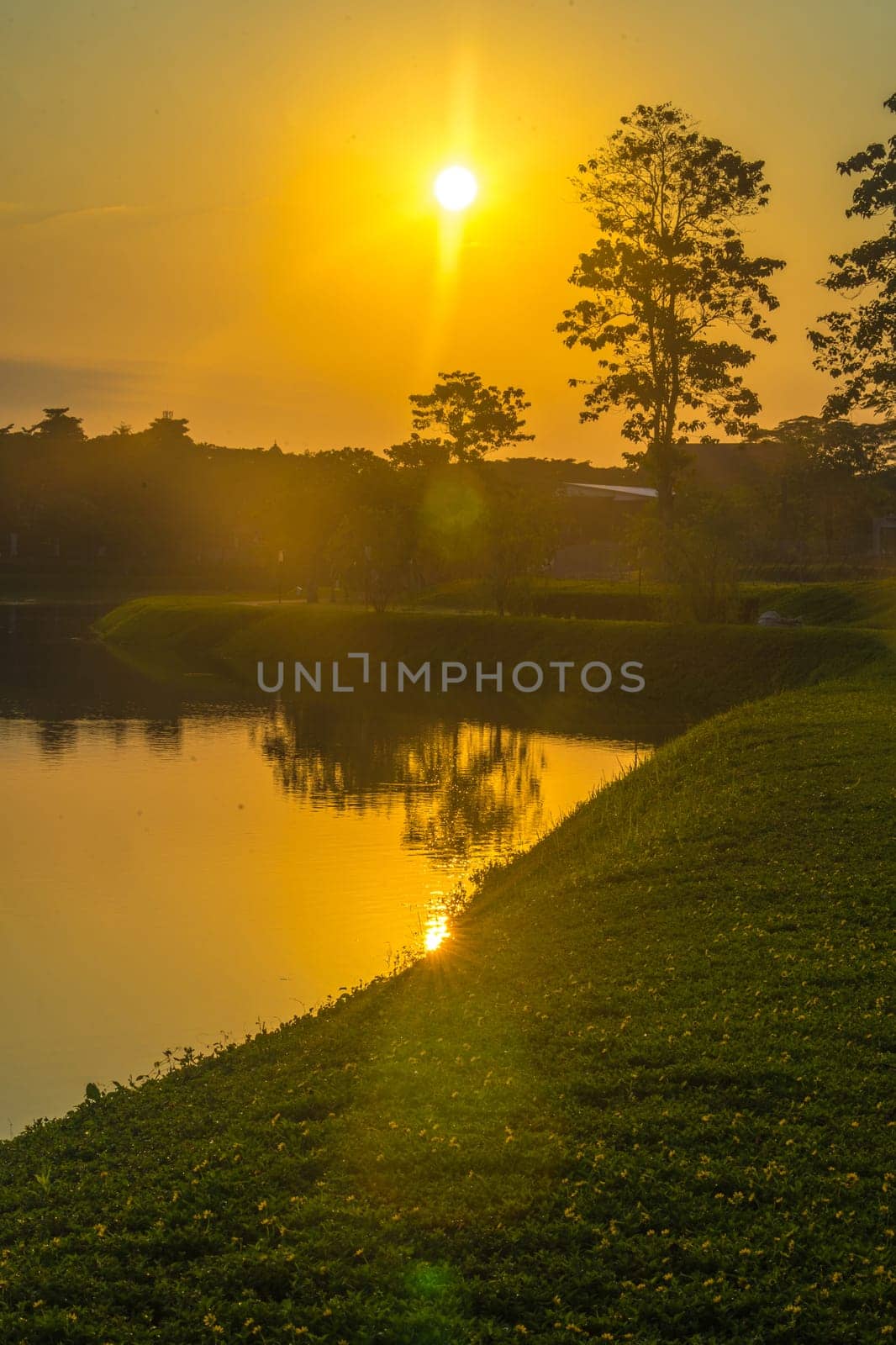 Beautiful sunrise at bsb lake located in Mijen, Semarang, Indonesia. Nature and landscape photo.
