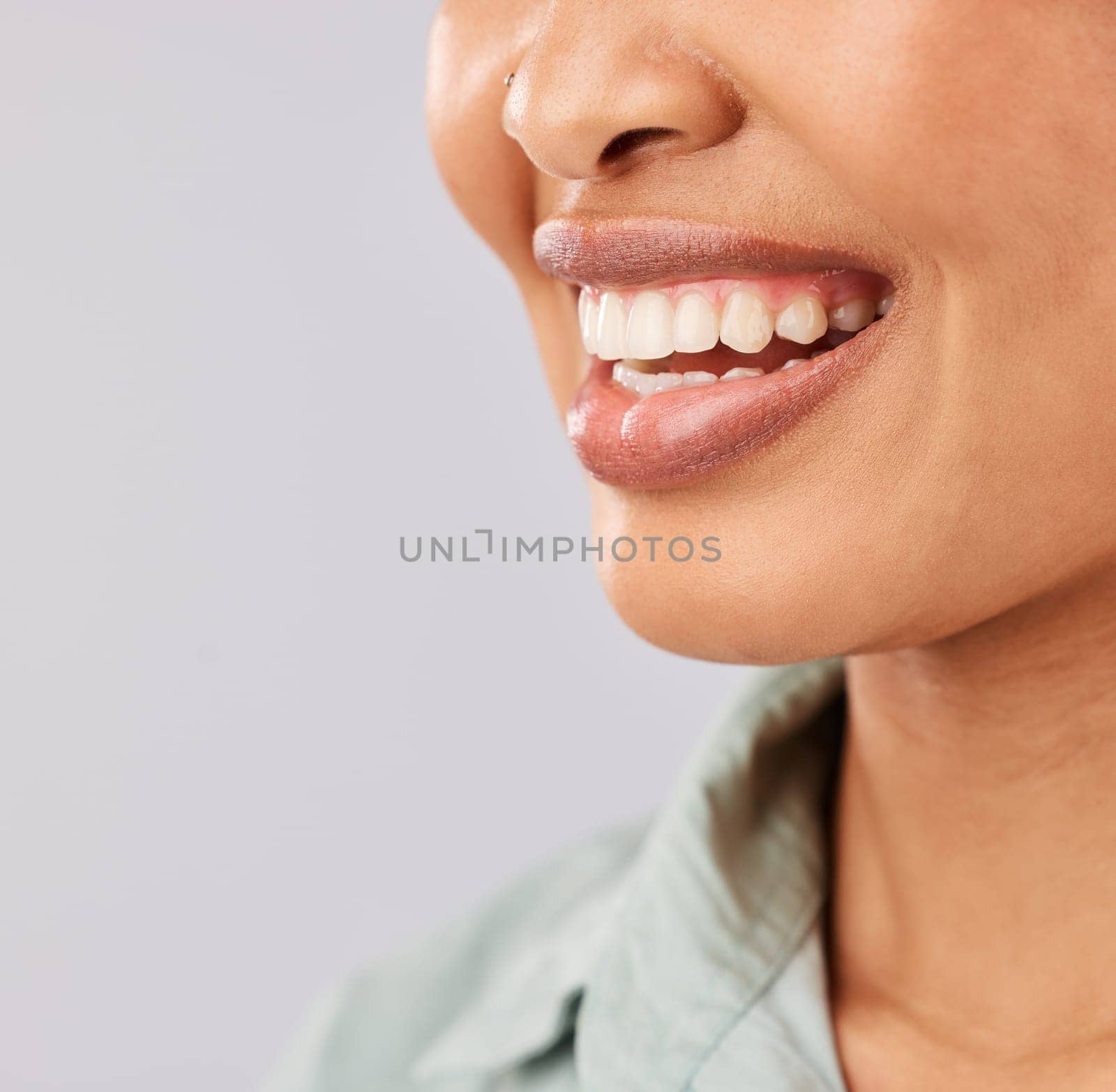 Smile, dental teeth and face of black woman in studio isolated on a white background mockup. Tooth care, cosmetics and happiness of female model or person with lip makeup and oral health for wellness by YuriArcurs