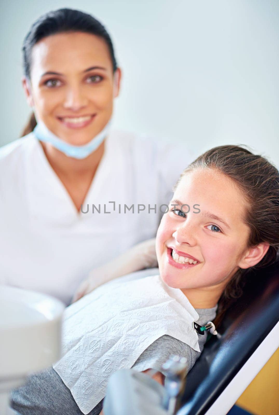 Another perfect smile. a female dentist and child in a dentist office