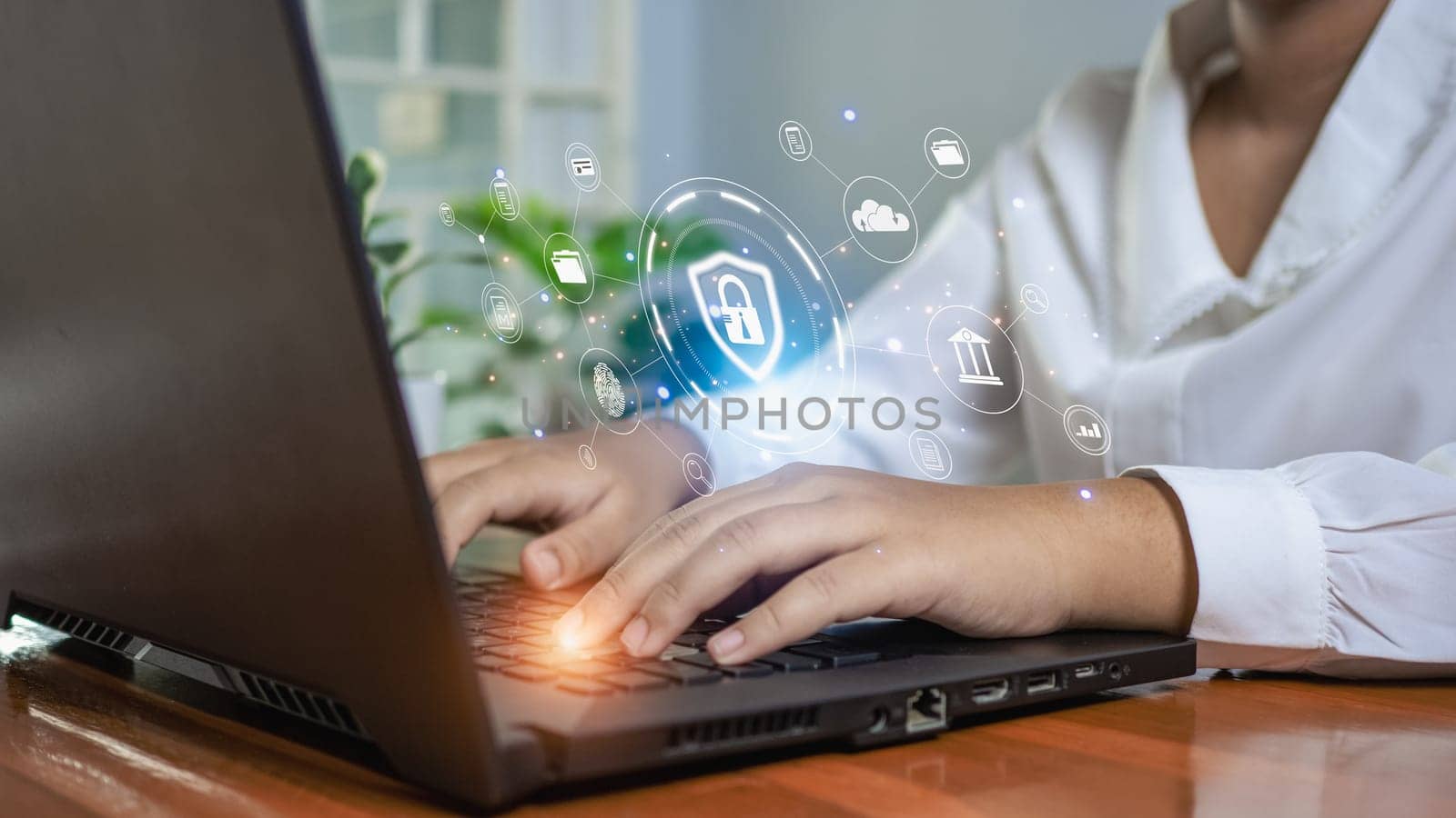Human hand working on computer and protection icon. Represents the code protection. Security concept and communication technology by Unimages2527
