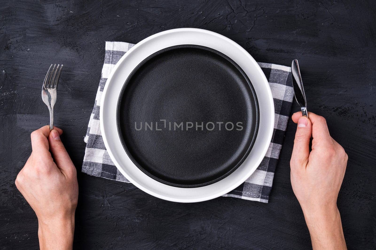 Restaurant and food, the gesture of a human hand on an empty white plate.