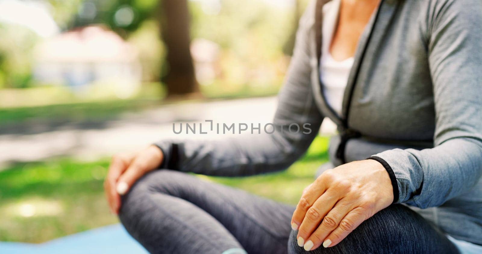 Woman in park, yoga and meditation with fitness outdoor, zen and calm with spiritual healing in park. Female person exercise in nature, pilates and meditate for health, wellness and mindfulness by YuriArcurs