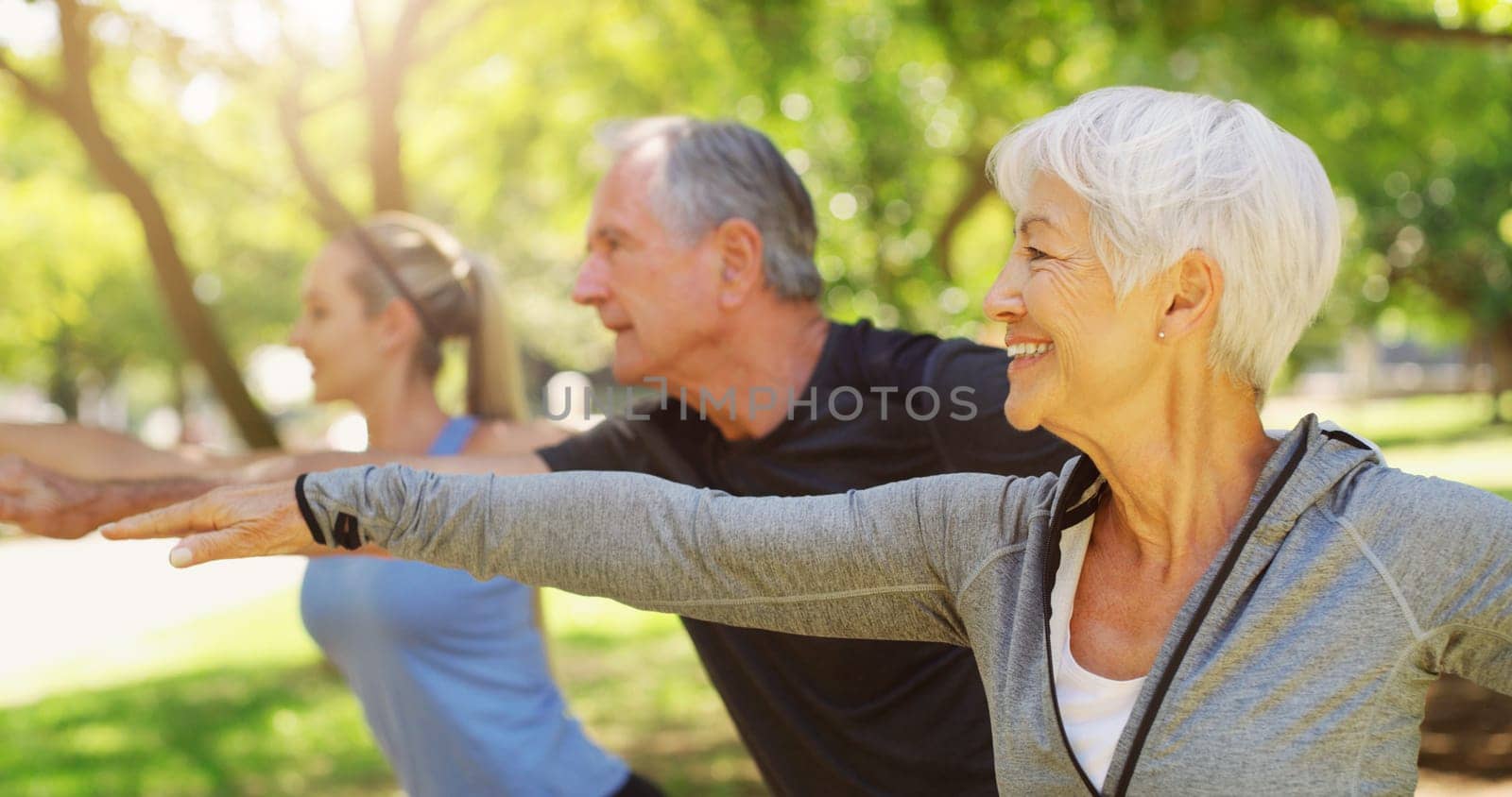 Yoga, fitness and an old couple with their personal trainer in a garden for a health or active lifestyle. Exercise, wellness or zen and senior people outdoor for training with their pilates coach by YuriArcurs