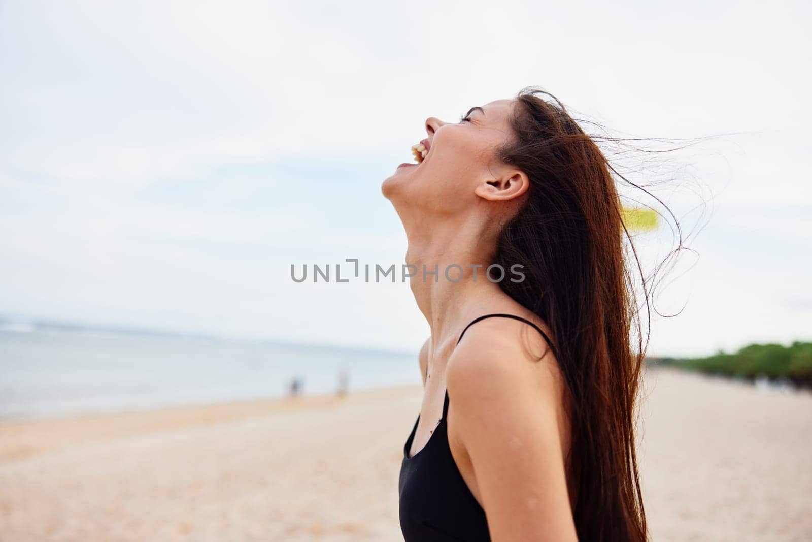 adult woman space freedom lifestyle beach sea holiday sky summer sand outdoor smile nature happiness vacation ocean young relax peaceful copy carefree