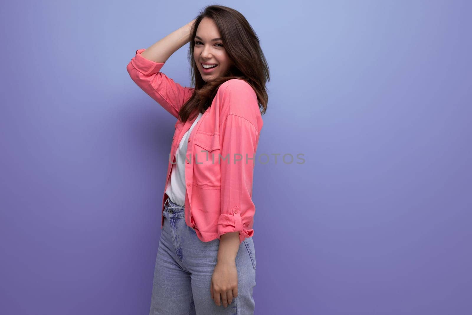 pretty brunette young woman in casual outfit smiling over isolated background.