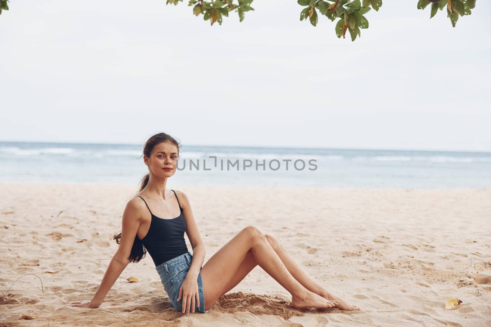 woman smile sand freedom beach tropical travel sea sitting nature vacation by SHOTPRIME