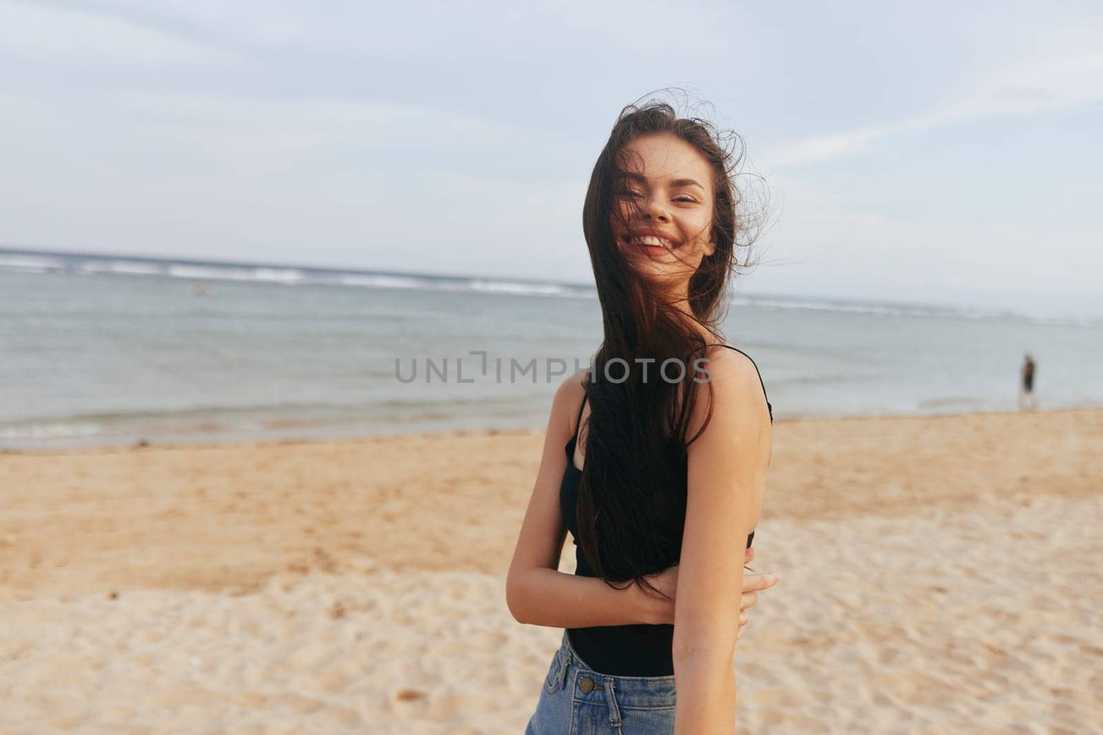 woman long vacation leisure sunset summer carefree sea adult relax enjoyment lifestyle beach hair copy-space female smile running sunlight sand beauty ocean