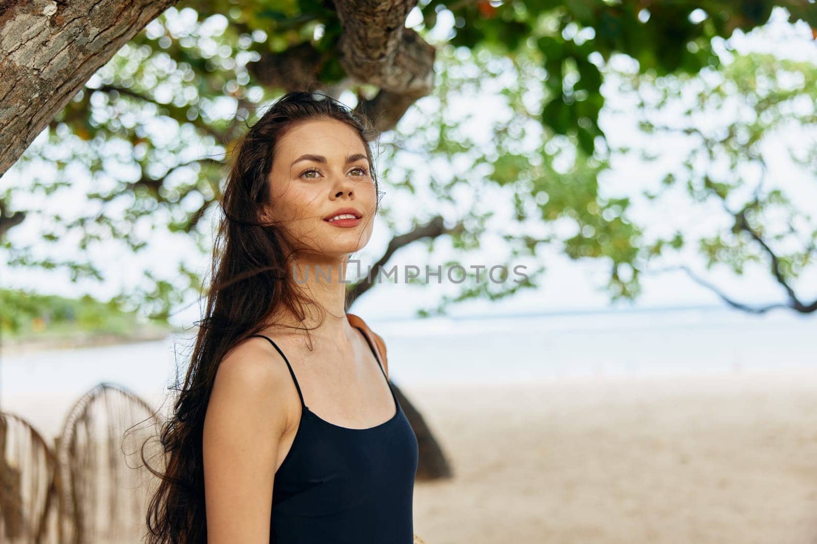 person woman nature sunlight sand leisure enjoyment summer ocean walking sea smile beautiful young holiday tropical dress beach vacation peaceful relax