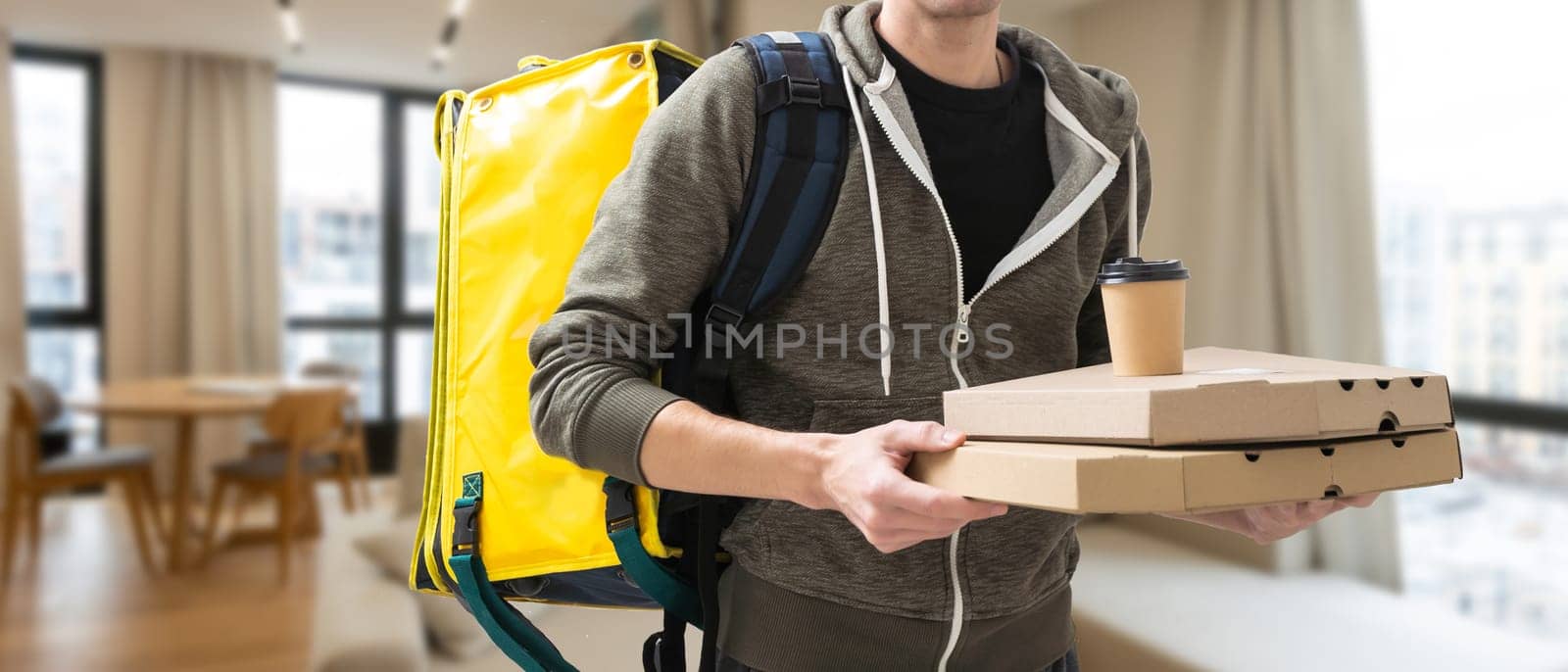 Delivery employee man hold thermal bag backpack with food work as courier.