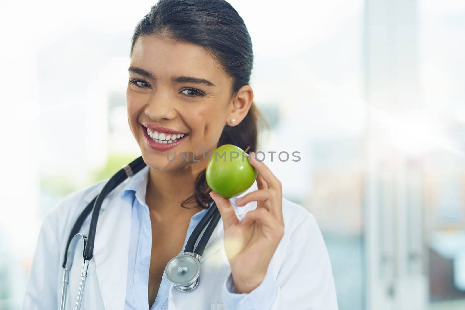 Doctor, portrait and smile of woman with apple for healthy diet, nutrition or wellness mockup. Face, nutritionist and medical person with fruit for advice, healthcare and food for health benefits. by YuriArcurs