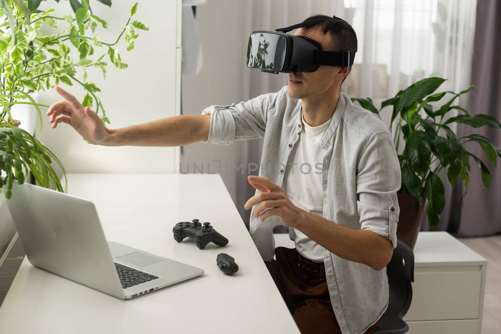 Man wearing virtual reality goggles. Studio shot by Andelov13