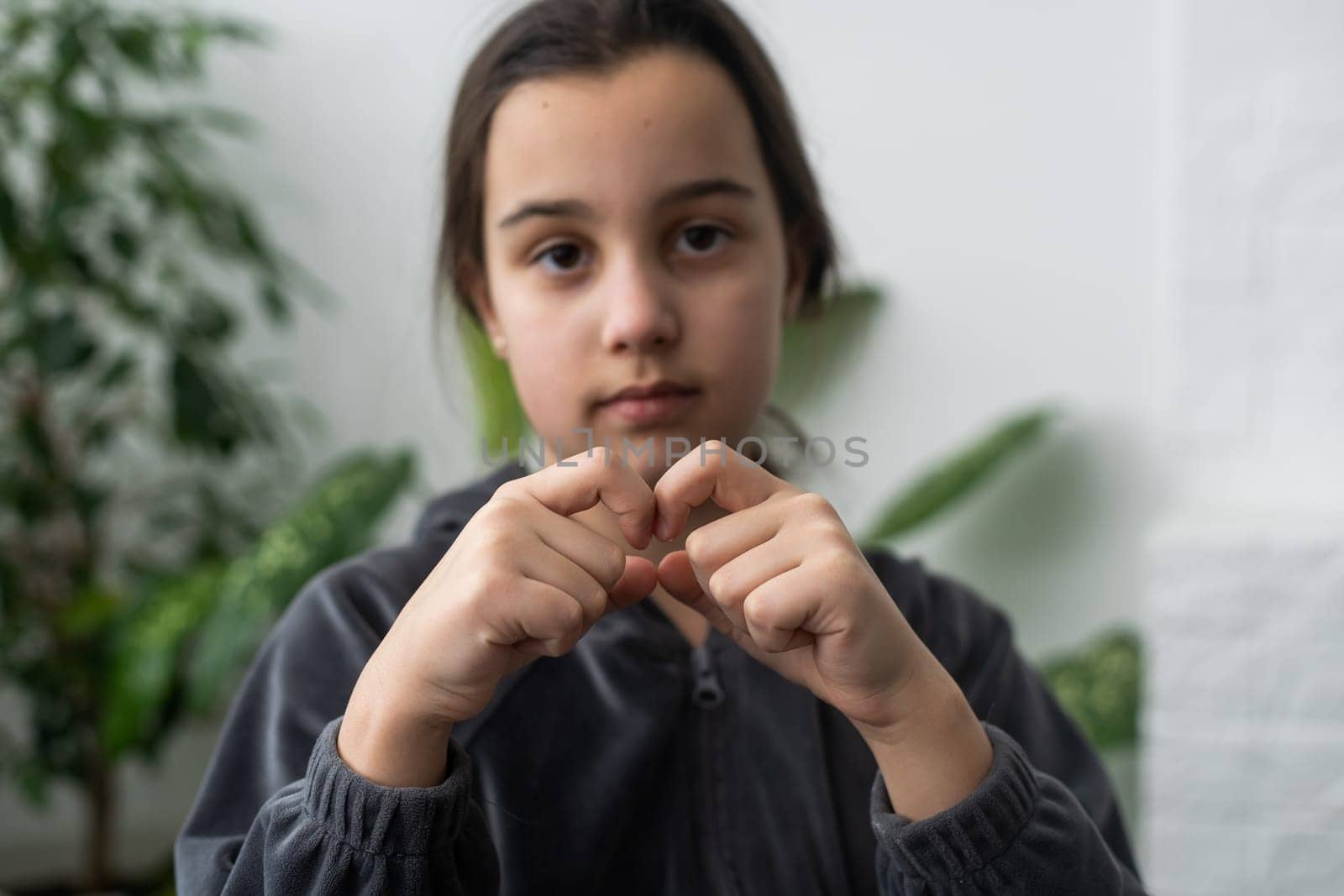 Beautiful smiling deaf girl using sign language. by Andelov13