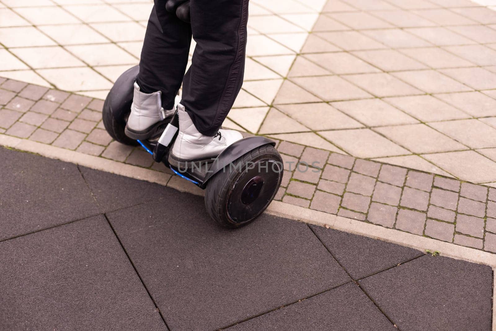 Personal eco transport, gyro scooter, smart balance wheel. A little girl riding a electric self-balancing scooter. child is balancing on a gyroscooter.