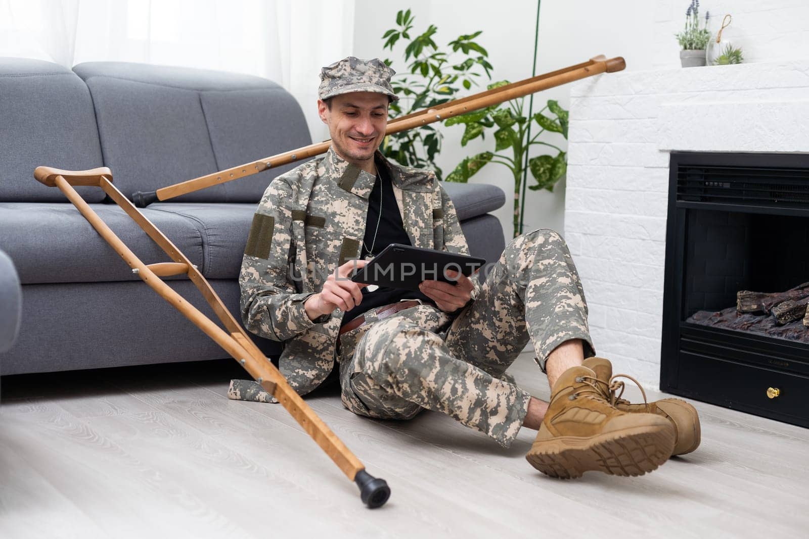 military man on crutches with tablet doctor.