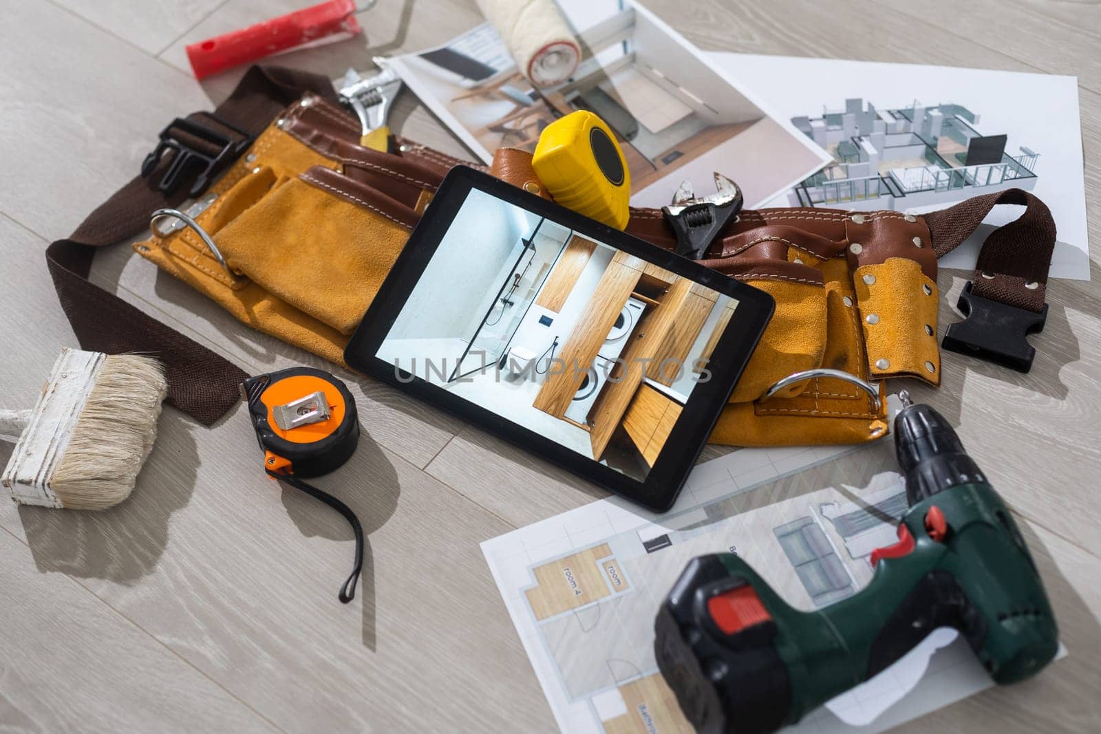 Tablet computer with architecture and construction tools and blueprints.