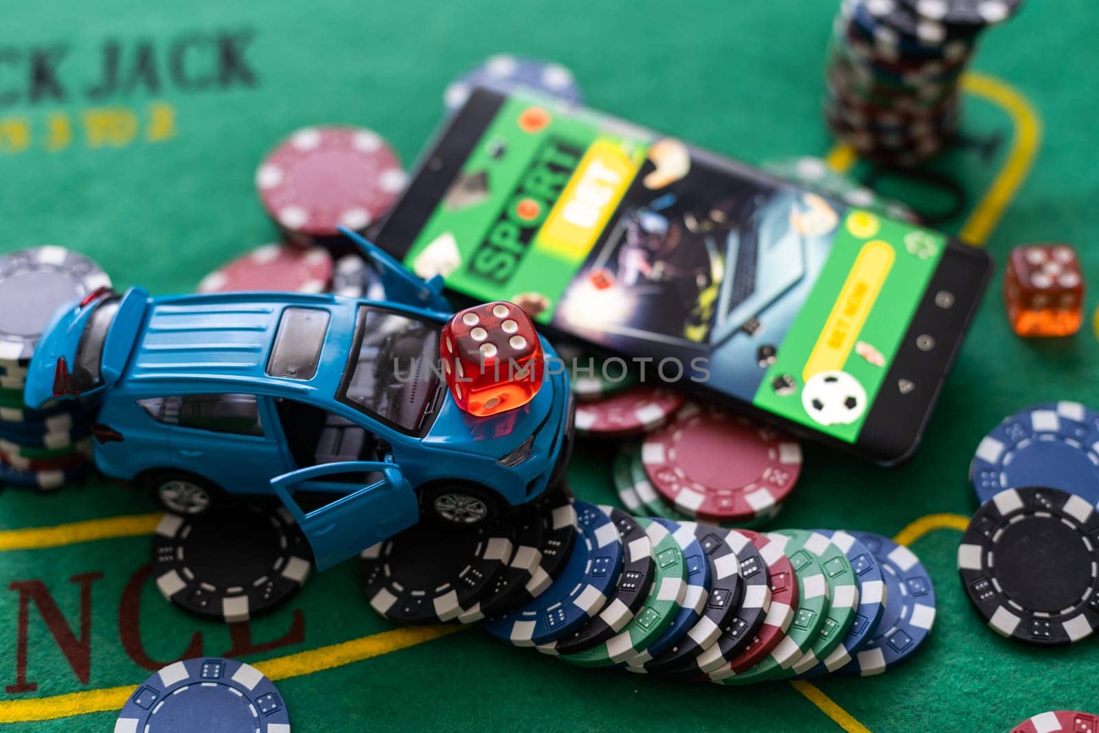 smartphone with betting on sports, casino, toy car by Andelov13