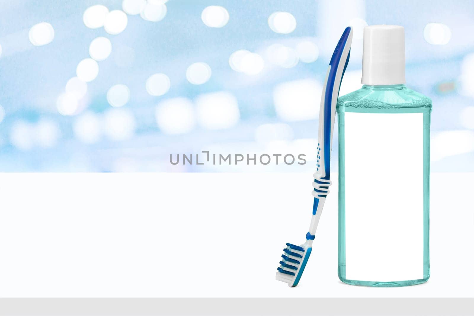 Toothbrush on table on light background by Fabrikasimf
