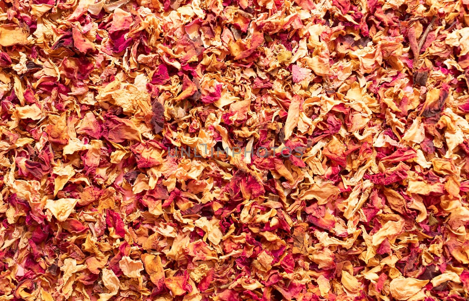 Texture dried rose petals, leaves. Potpourri, desiccated rose buds background. Top view aromatic herbal beverage made from fragrant flowers. Horizontal from above, space for text. High quality photo