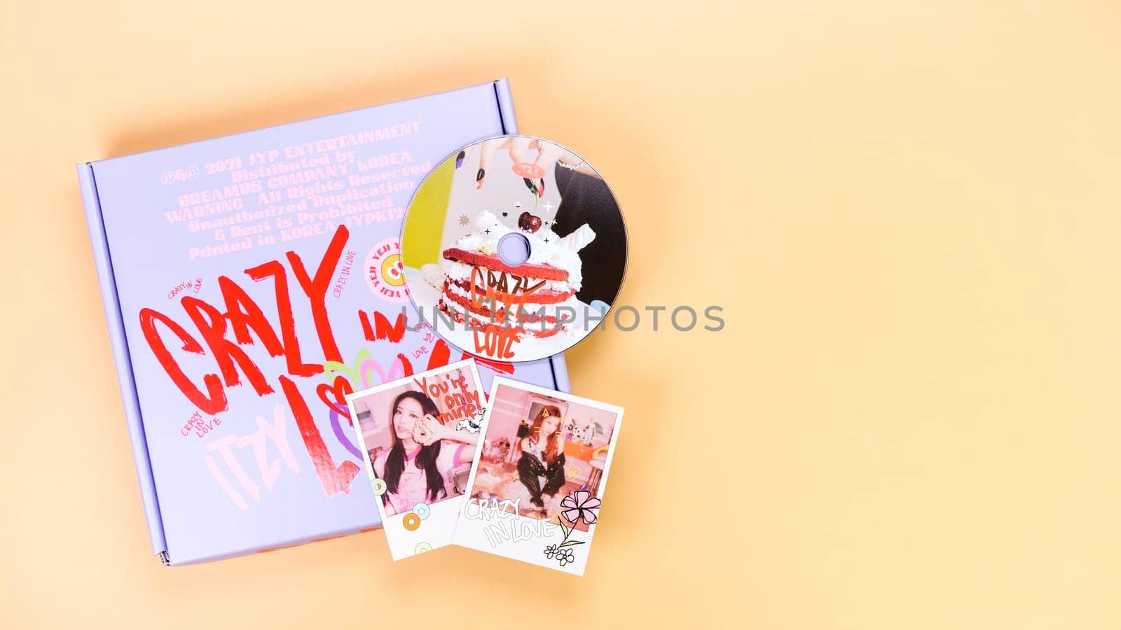 K-pop group Itzy CRAZY IN LOVE 1st Album on yellow background. Special edition music CD. South Korean girl group Itzy. Space for text. Gatineau, QC Canada - March 10 2023.